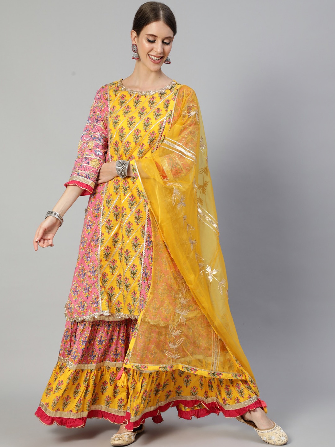 

Ishin Women Mustard Yellow Floral Embroidered Layered Gotta Patti Pure Cotton Kurti with Sharara & With