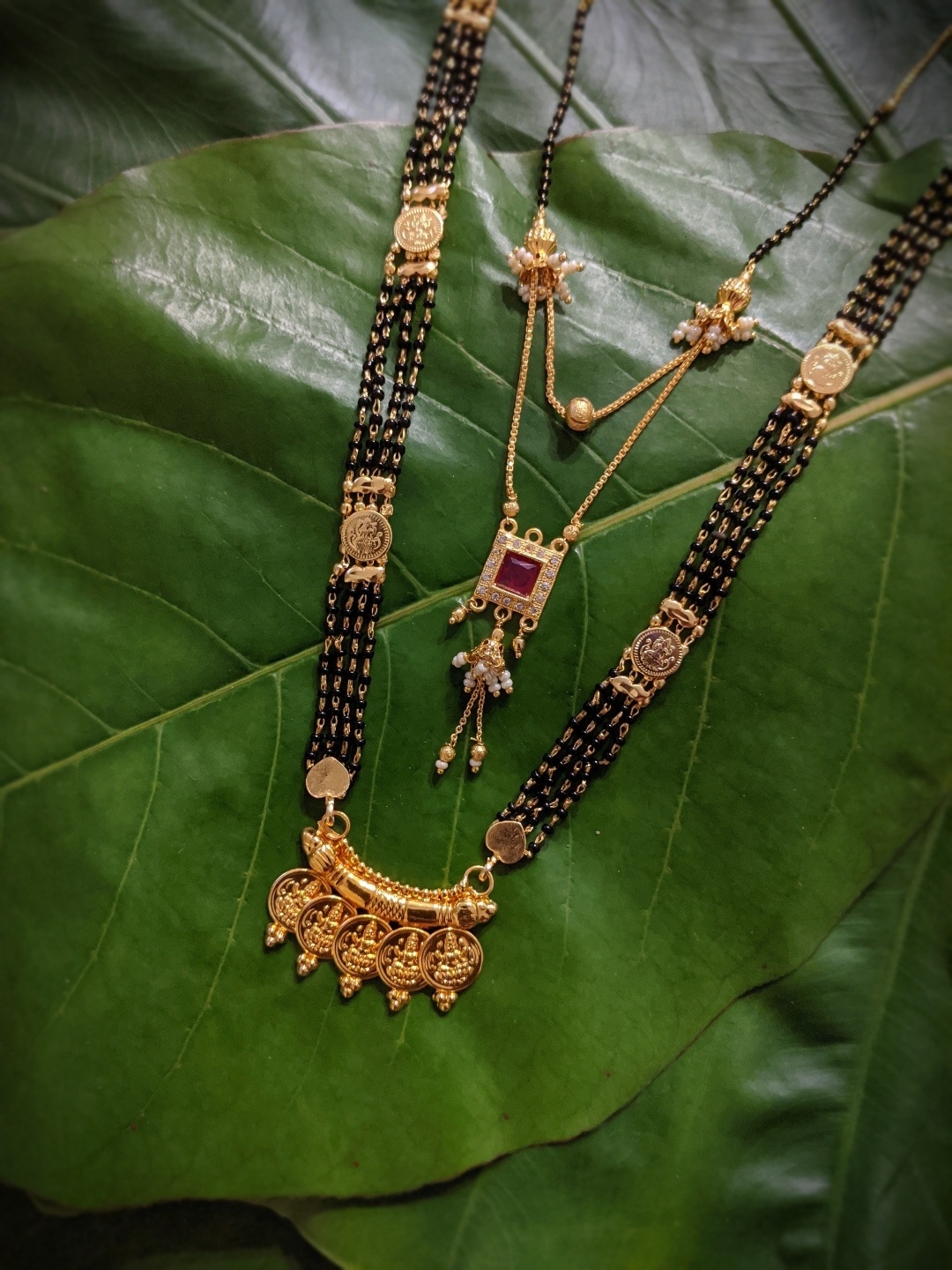 

Digital Dress Room Set Of 2 Gold-Plated White & Red Stone Studded Black Beaded Mangalsutra