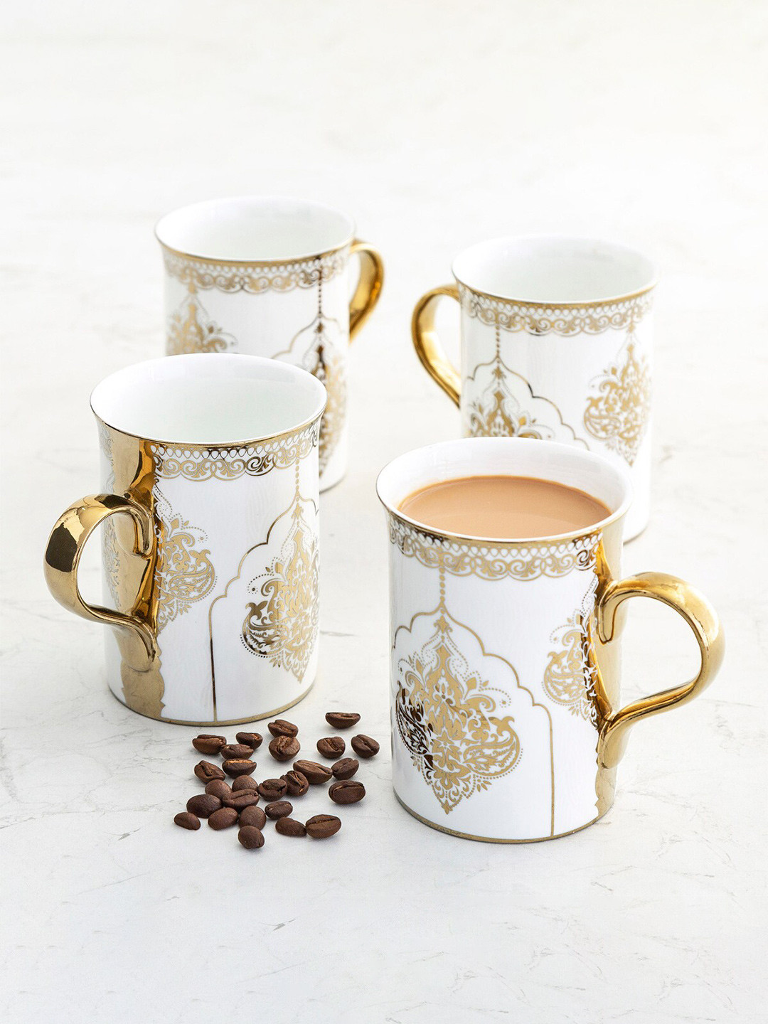 

Home Centre Set Of 4 Gold-Toned & White Printed Bone China Luxury Ebony Matte Mugs