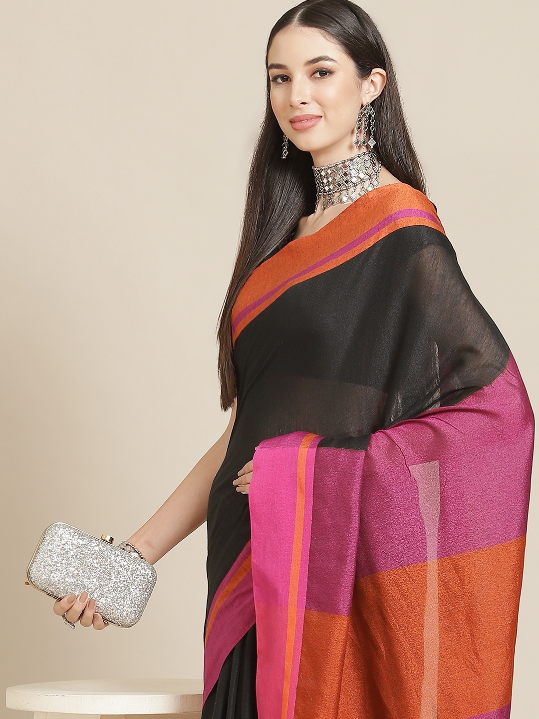 

Anouk Black & Orange Solid Linen Blend Saree
