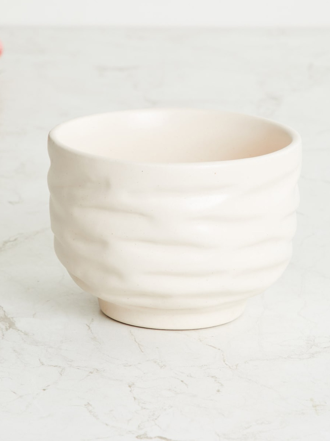 

Home Centre Beige Textured Ceramic Planter