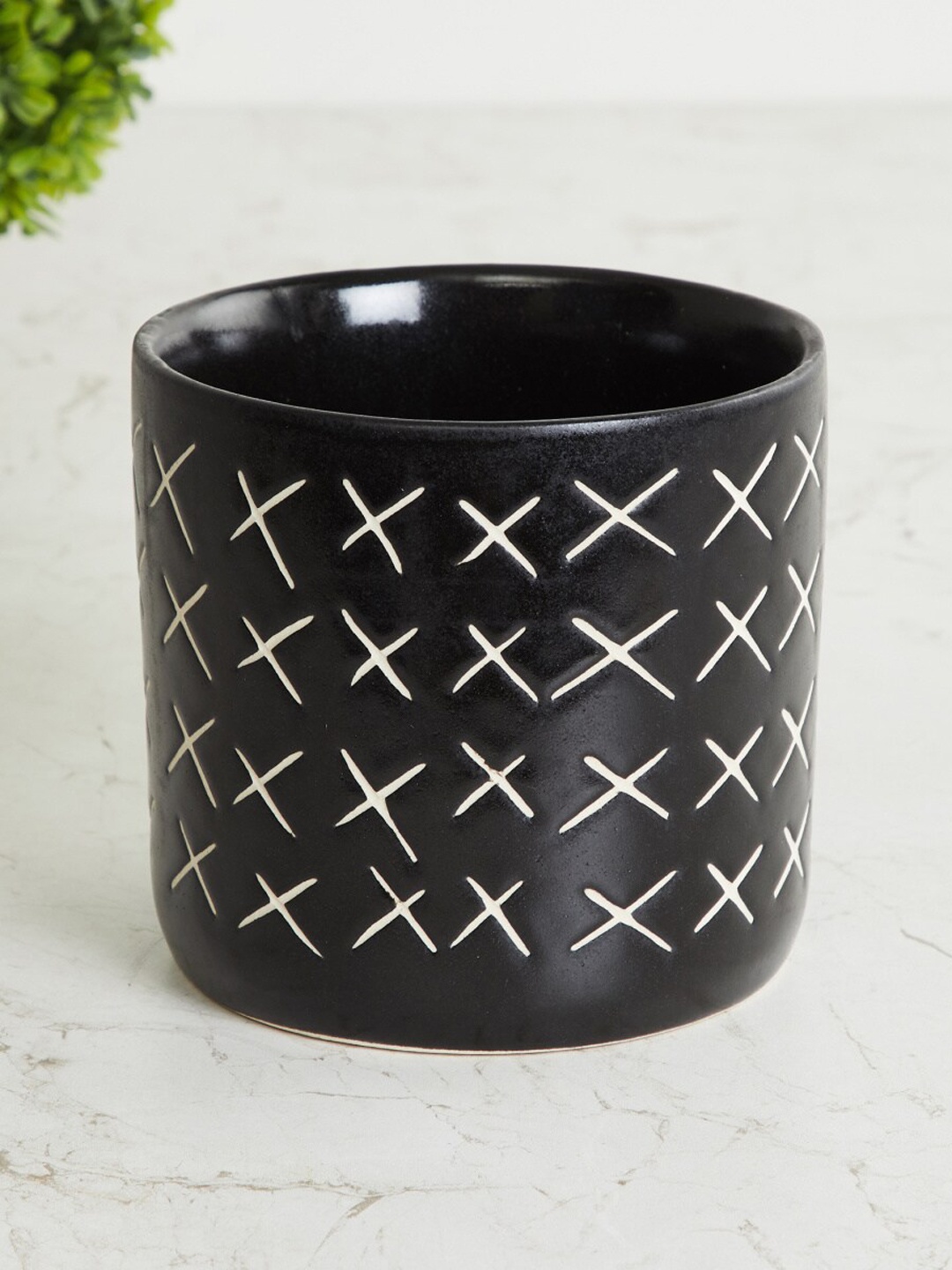 

Home Centre Black & White Textured Ceramic Planter