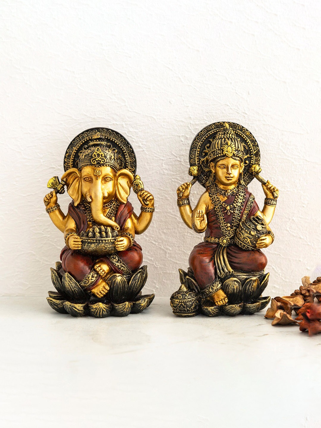 

Home Centre Gold-Toned & Brown Polyresin Goddess Lakshmi & Lord Ganesha Figurine