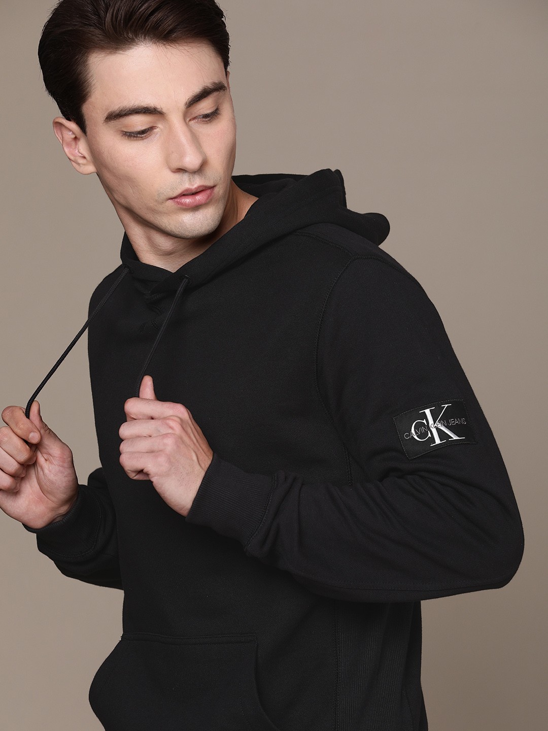 

Calvin Klein Jeans Men Black Solid Hooded Sweatshirt