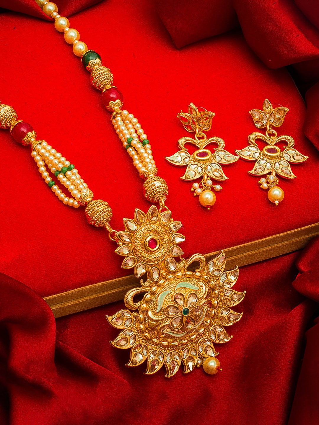 

aadita Gold-Plated Red & Green Stone-Studded Pearls Beaded Temple Jewellery Set