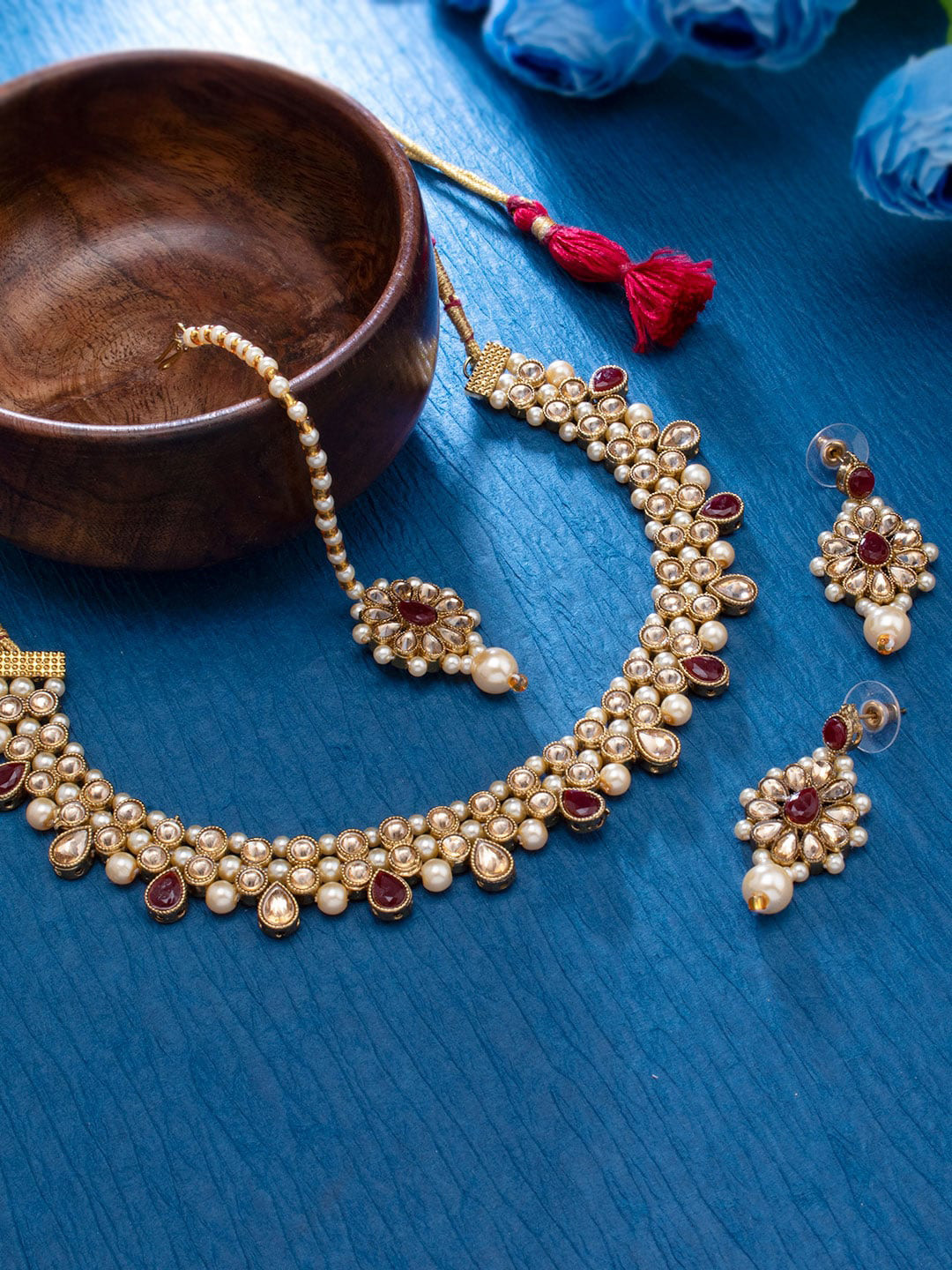 

Sukkhi Gold-Plated White & Red Kundan Studded & Pearl Beaded Jewellery Set