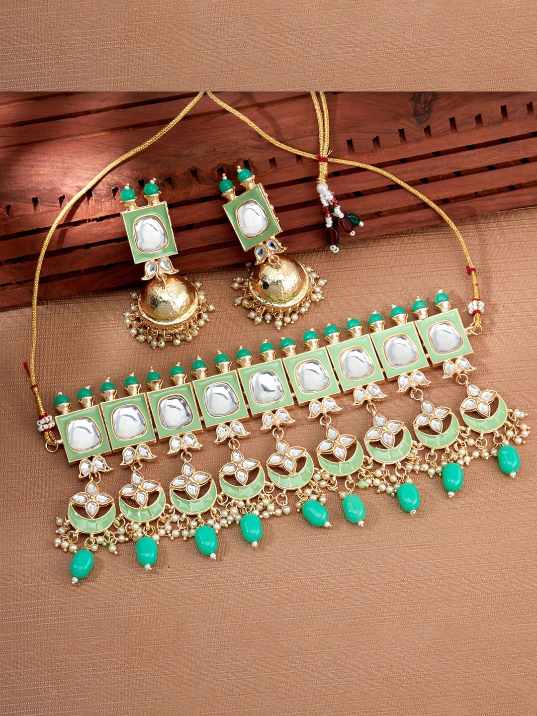 

Sukkhi Gold-Plated Lime Green Kundan & White Beaded Studded Meenakari Jewellery Set