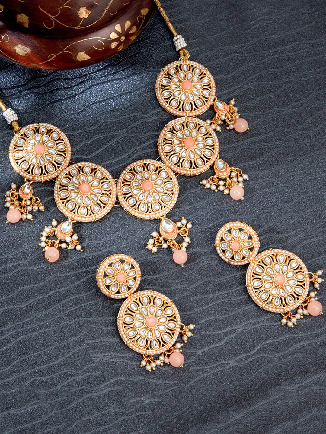 

Sukkhi Gold-Plated White & Peach-Coloured Stone-Studded Beaded Meenakari Jewellery Set