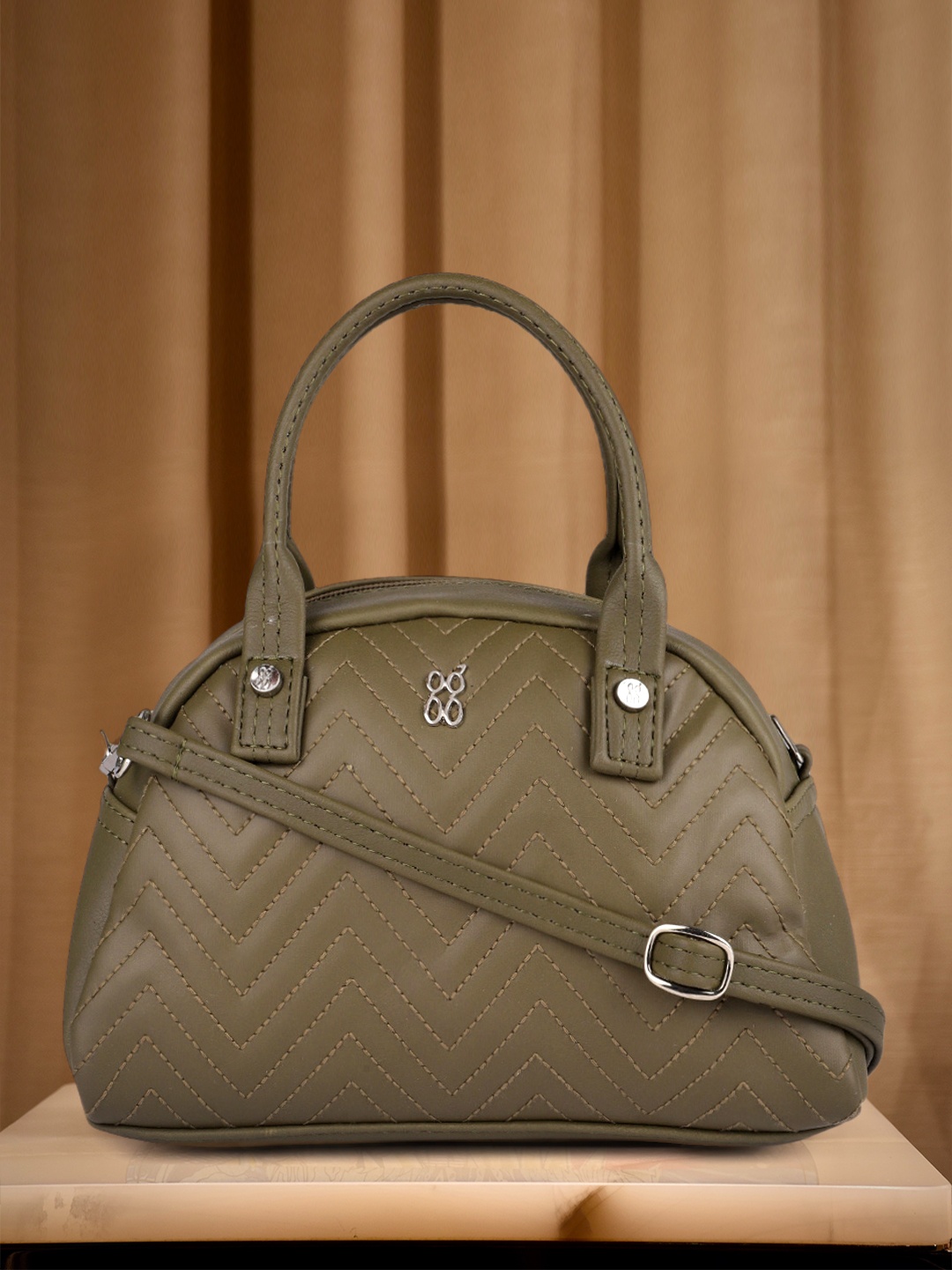 

Baggit Olive Green Quilted Handheld Bag