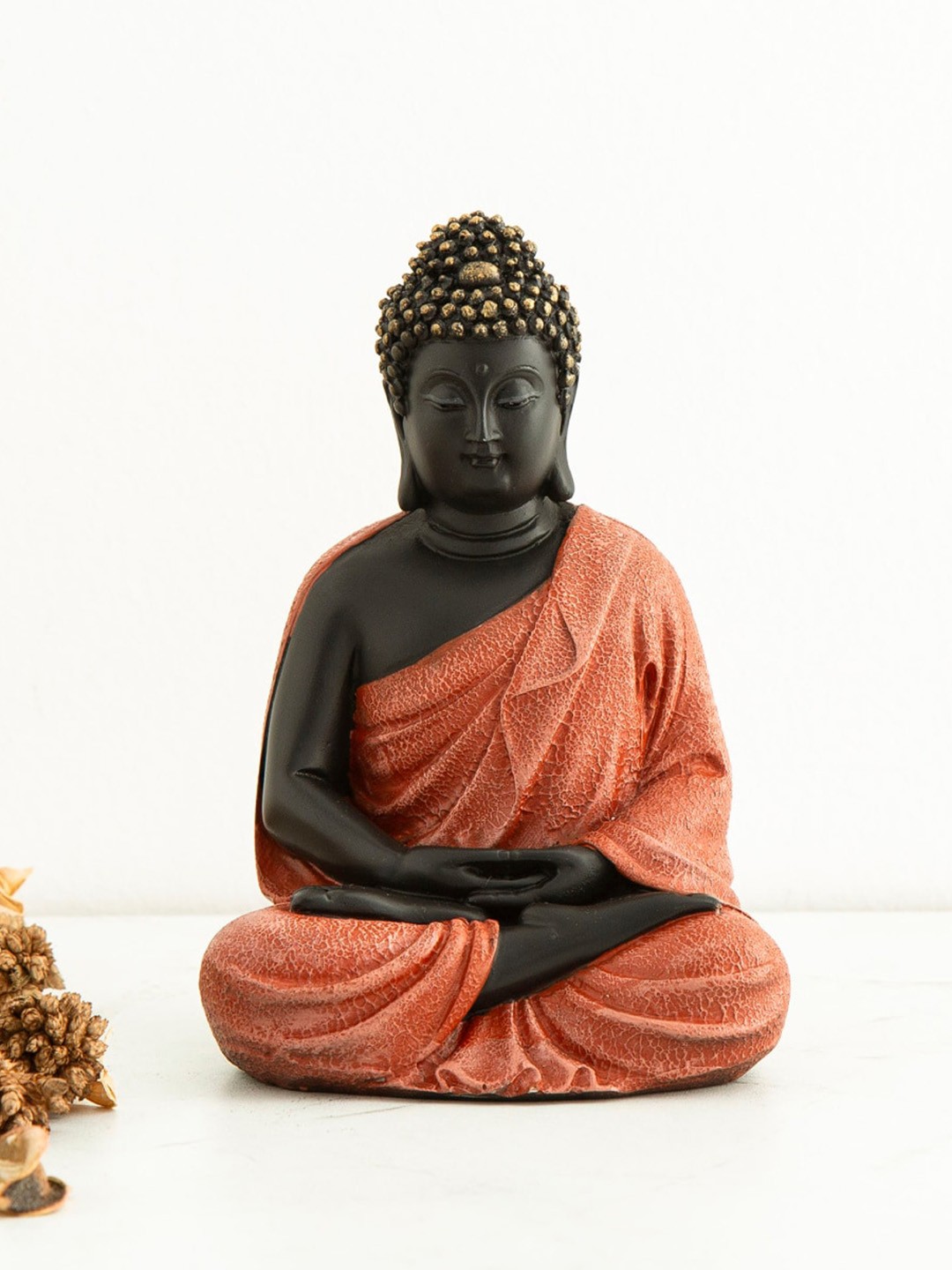 

Home Centre Black & Orange Buddha Figurine Showpiece