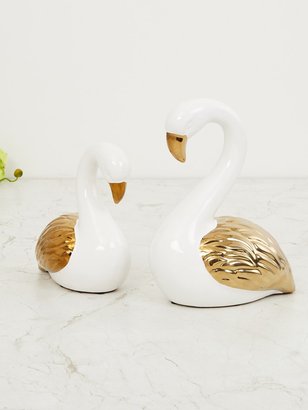 

Home Centre Set Of 2 Gold-Toned & White Porcelin Swan Figurine Showpiece
