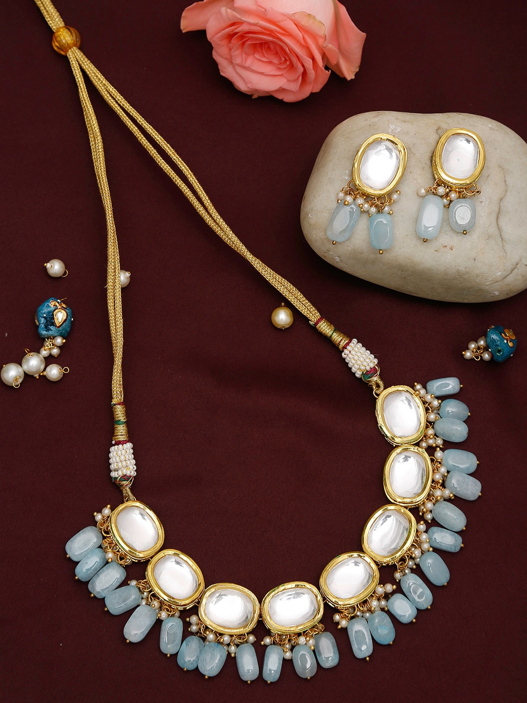 

Ruby Raang Gold-Plated White & Blue Kundan-Studded & Pearl Beaded Handcrafted Jewellery Set