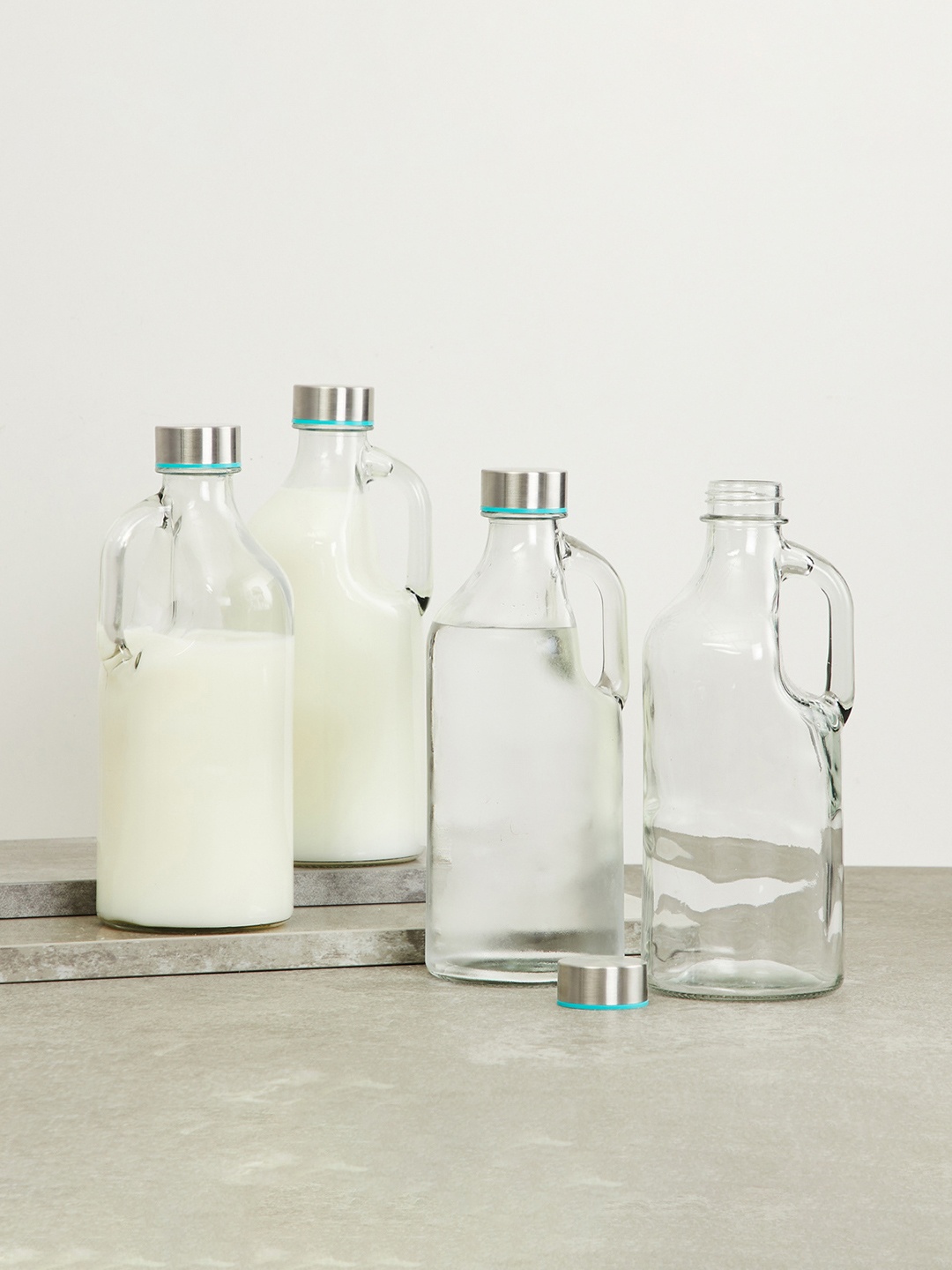 

Home Centre Marley Orlanto Transparent Set Of 4 Solid Glass Water Bottles - 1L Each