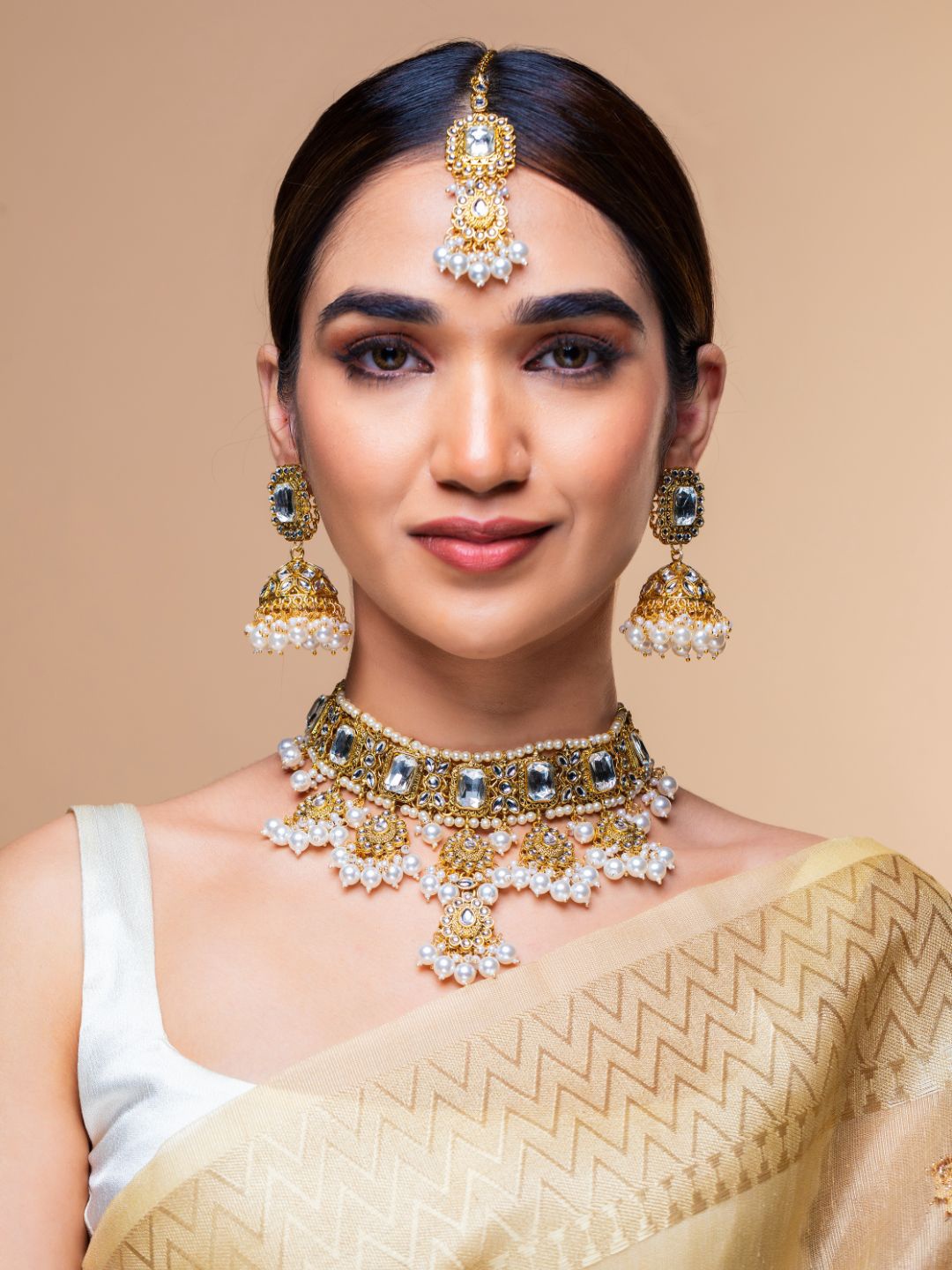 

Priyaasi Woman Gold-Plated White Stone-Studded & Pearl Beaded Handcrafted Jewellery Set