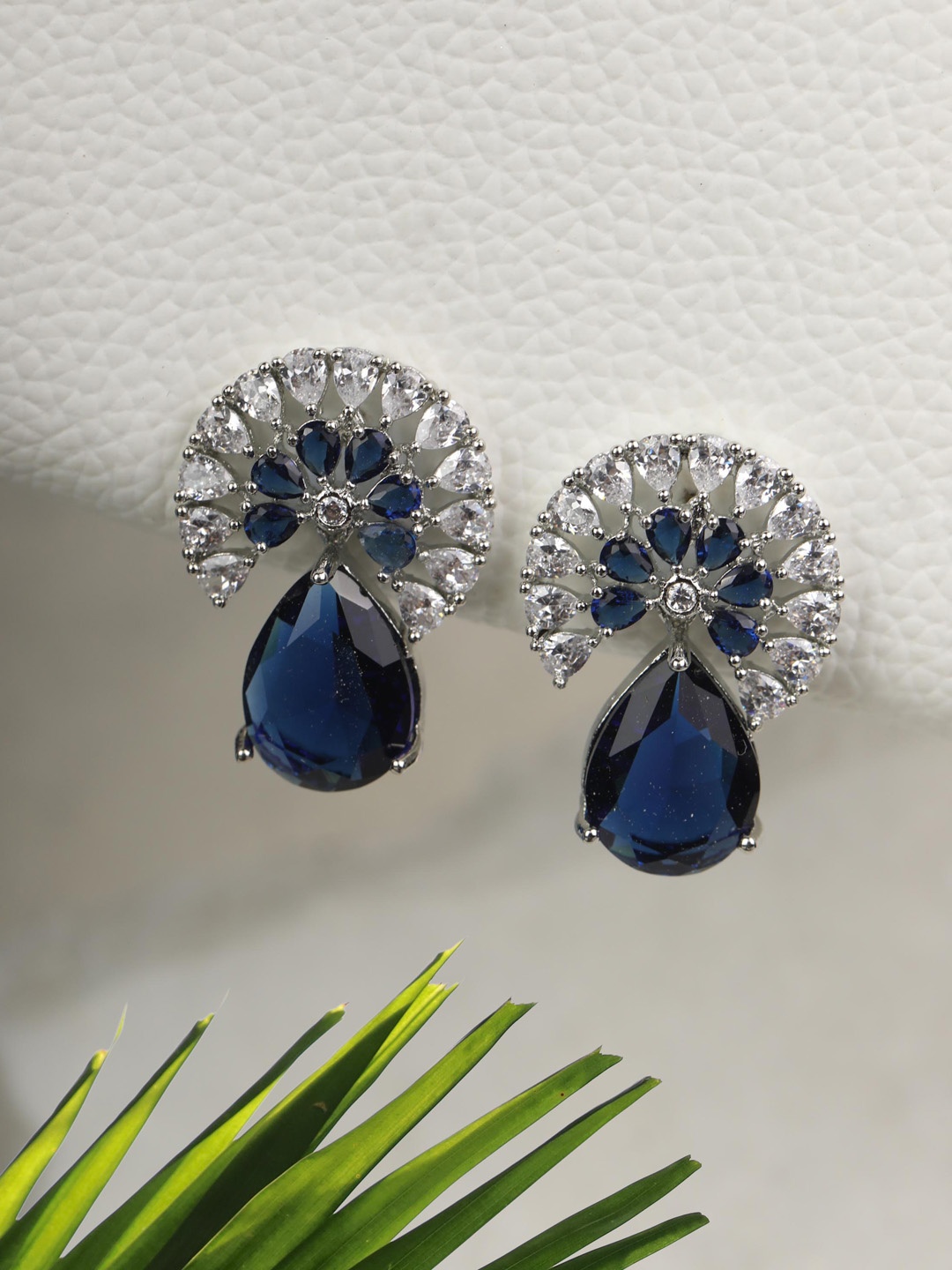 

Priyaasi Blue Silver Plated American Diamond Tear Drop Earrings