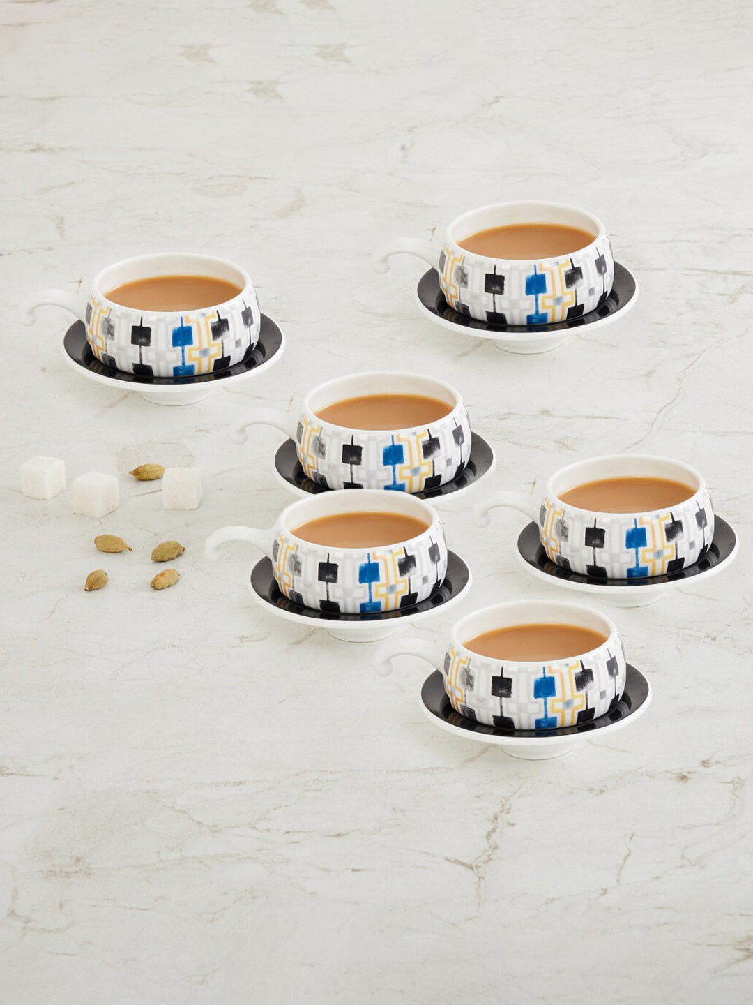 

Home Centre White Printed Bone China Matte Cups and Saucers Set of Cups and Mugs