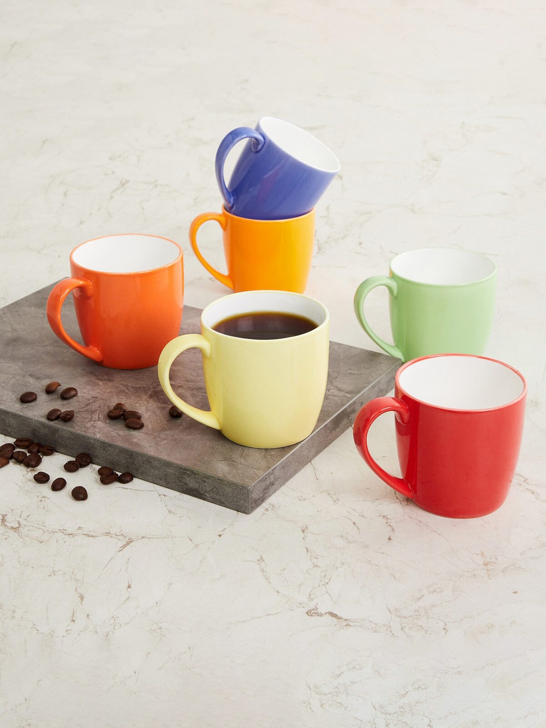 

Home Centre Blue & Yellow Solid Bone China Glossy Mugs Set of Cups and Mugs