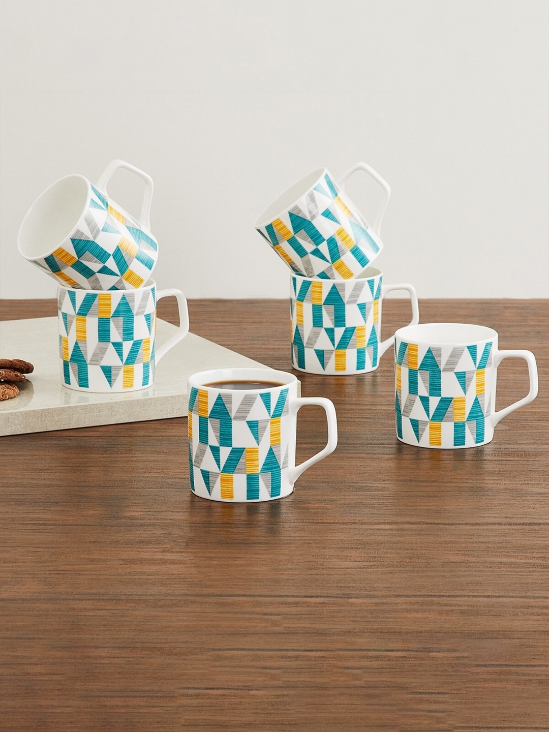 

Home Centre Set Of 6 Blue & White Geometric Printed Bone China Glossy Cups