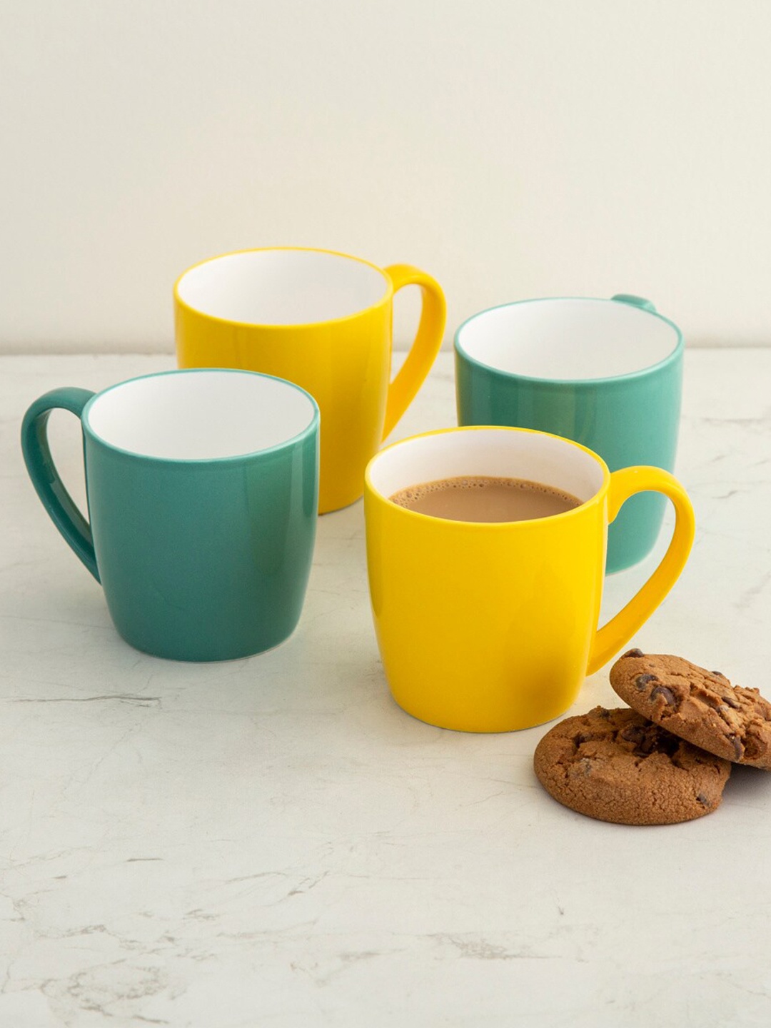 

Home Centre Green & Yellow Solid 4-Pieces Bone China Glossy Mugs Se