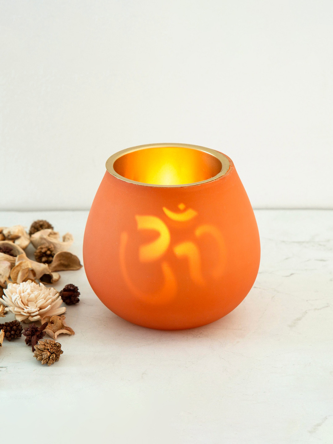

Home Centre Orange & Gold-Toned Corsica Om Cut-Out Flicker Votive Candle Holder