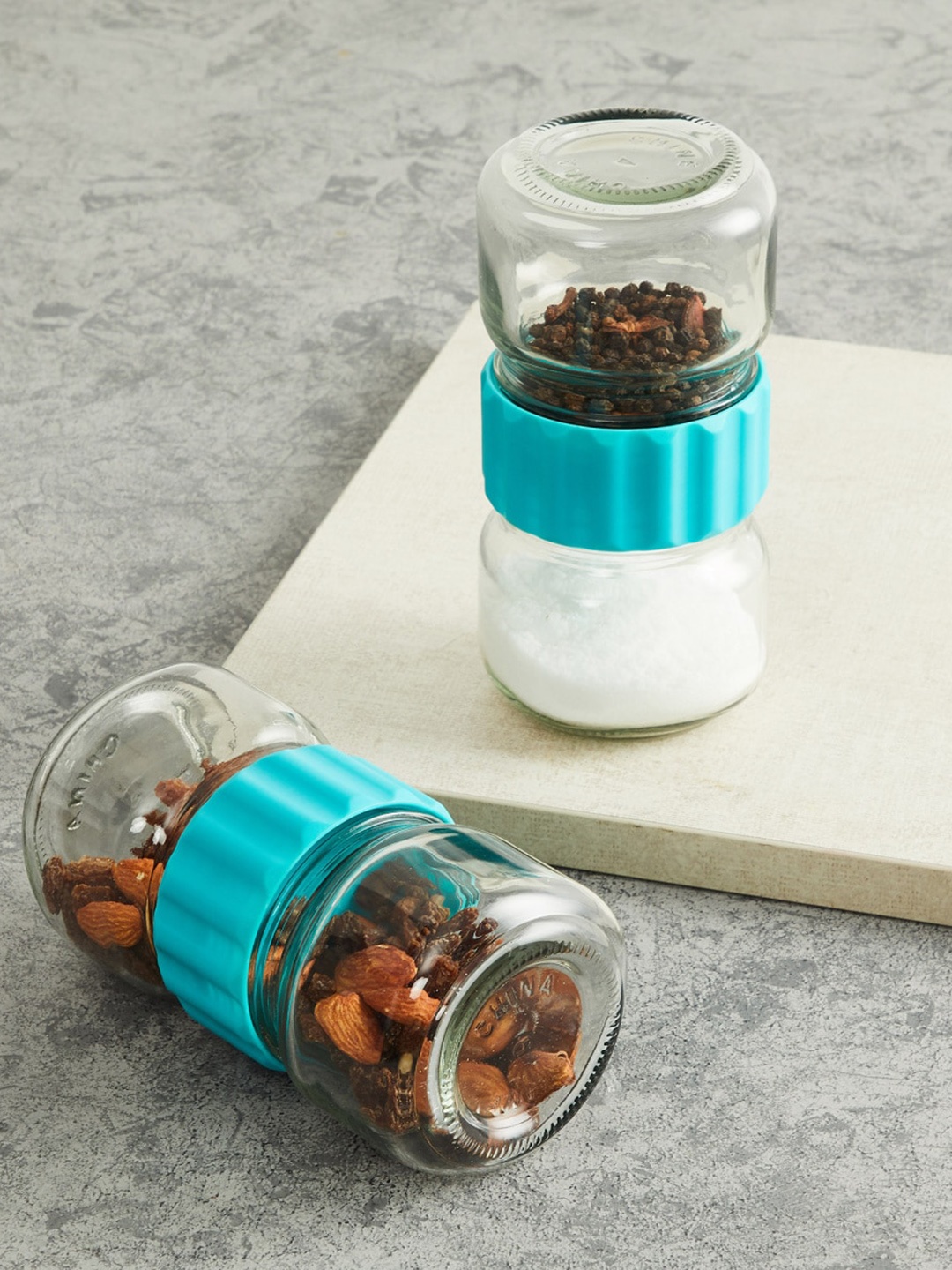 

Home Centre Set Of 4 Blue & Transparent Solid Glass Storage Jars 250ml