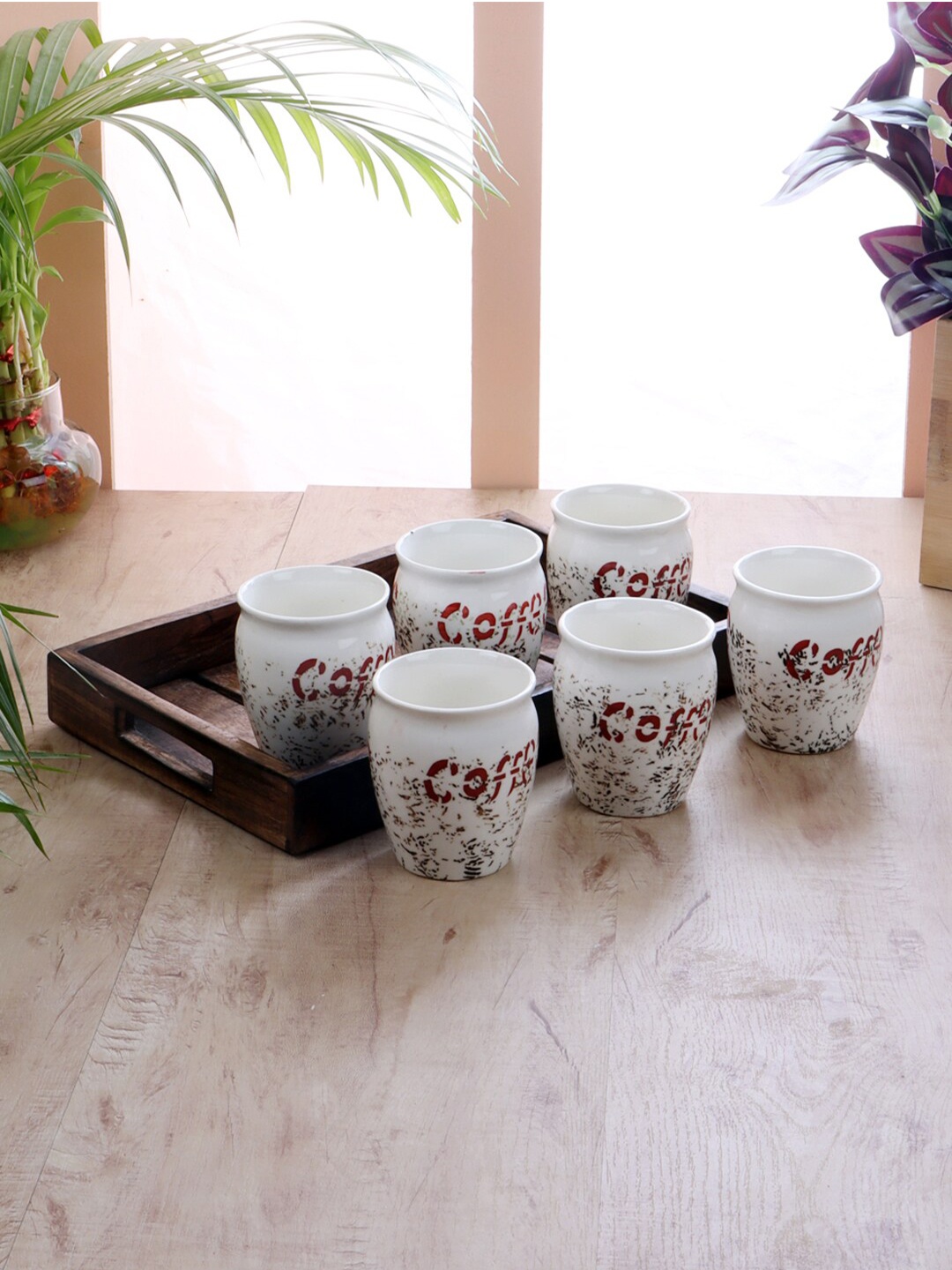 

CDI Set Of 6 White & Maroon Printed Ceramic Glossy Cups with Wooden Tray