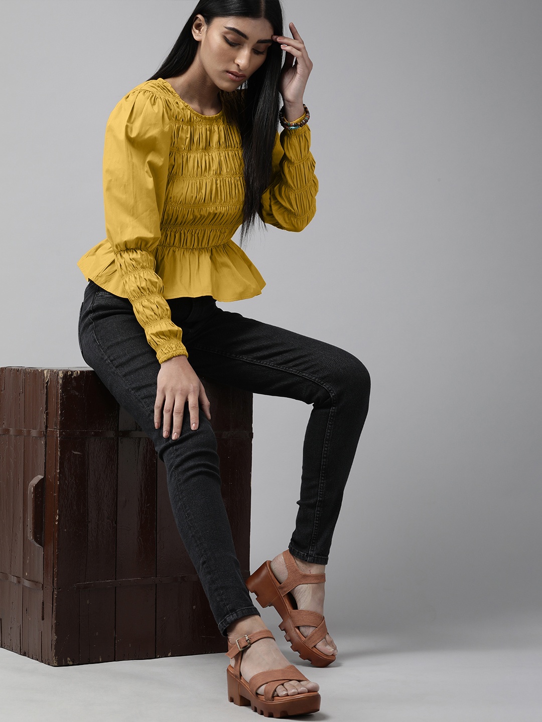 

The Roadster Lifestyle Co Mustard Yellow Solid Smocking Puff Sleeves Pure Cotton Peplum Top