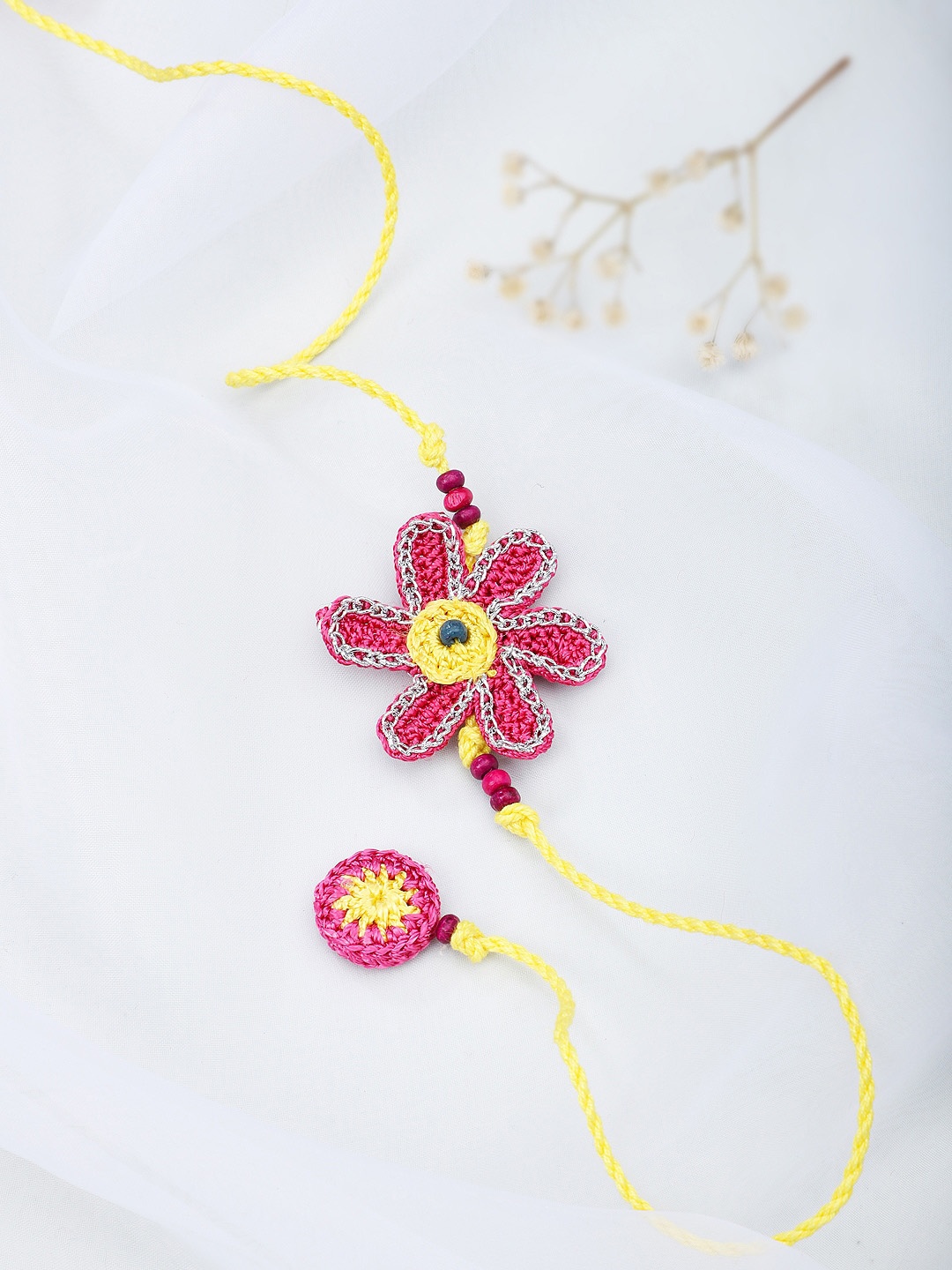 

Fabindia Pink & Yellow Thread Rakhi