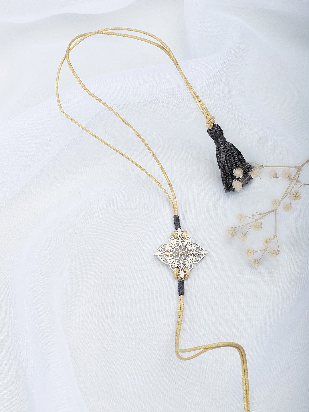 

Fabindia Beige & Silver-Toned Wraparound Rakhi