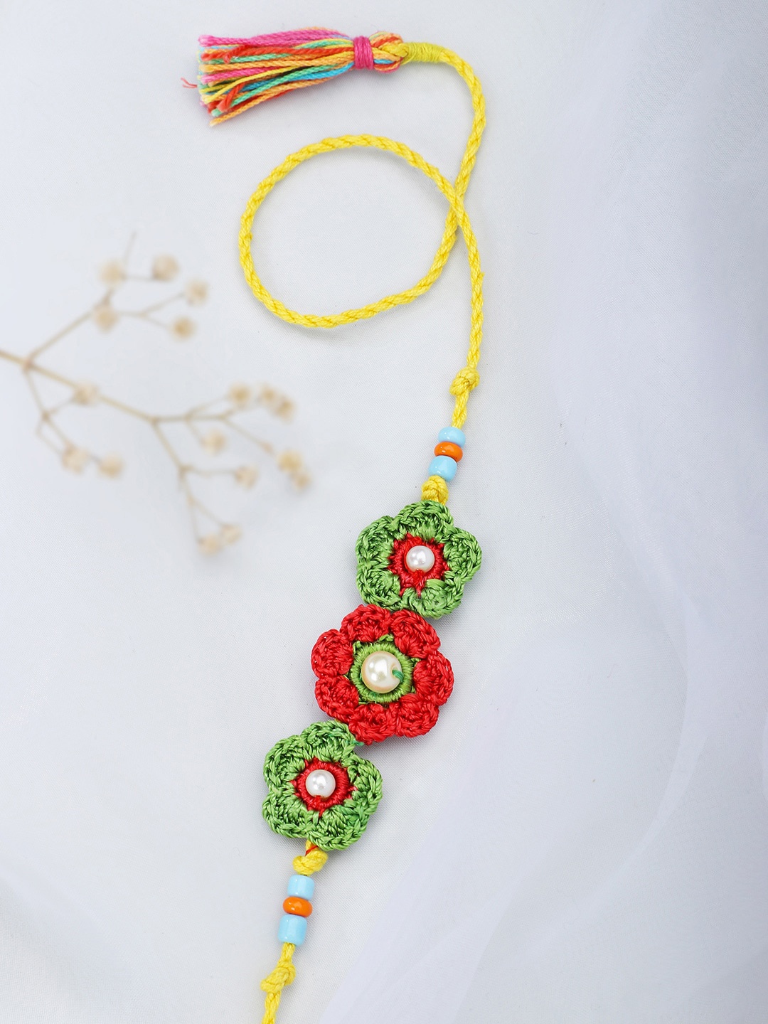 

Fabindia Yellow & Green Thread Rakhi