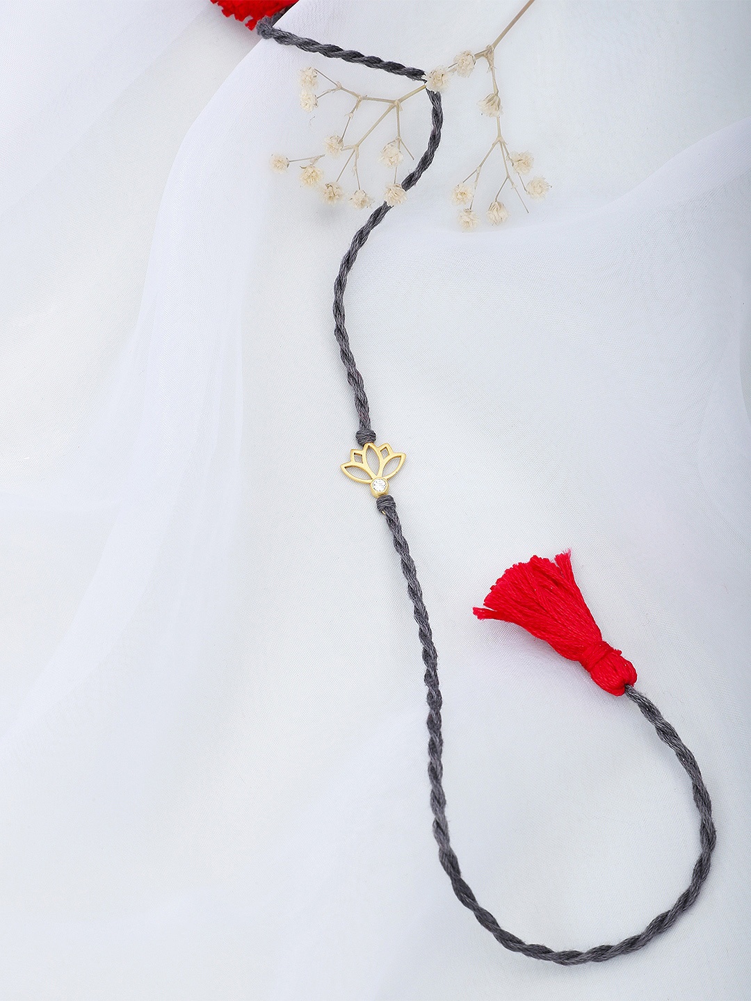 

Fabindia Grey & Gold-Plated Thread Rakhi