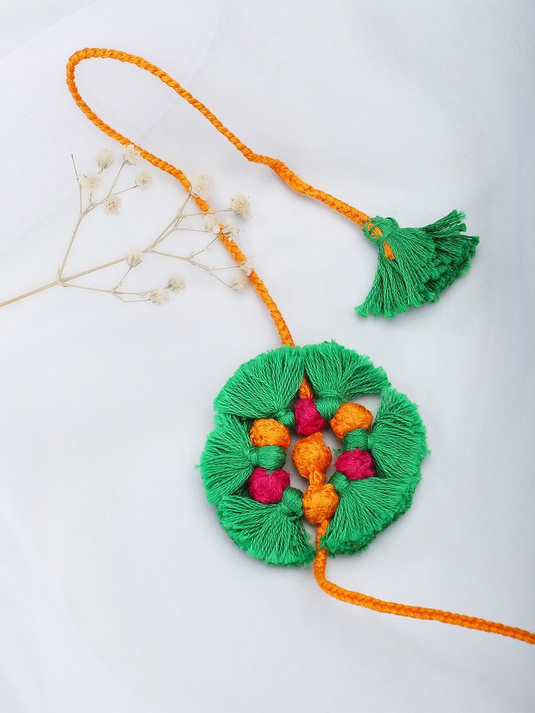 

Fabindia Green & Yellow Thread Rakhi