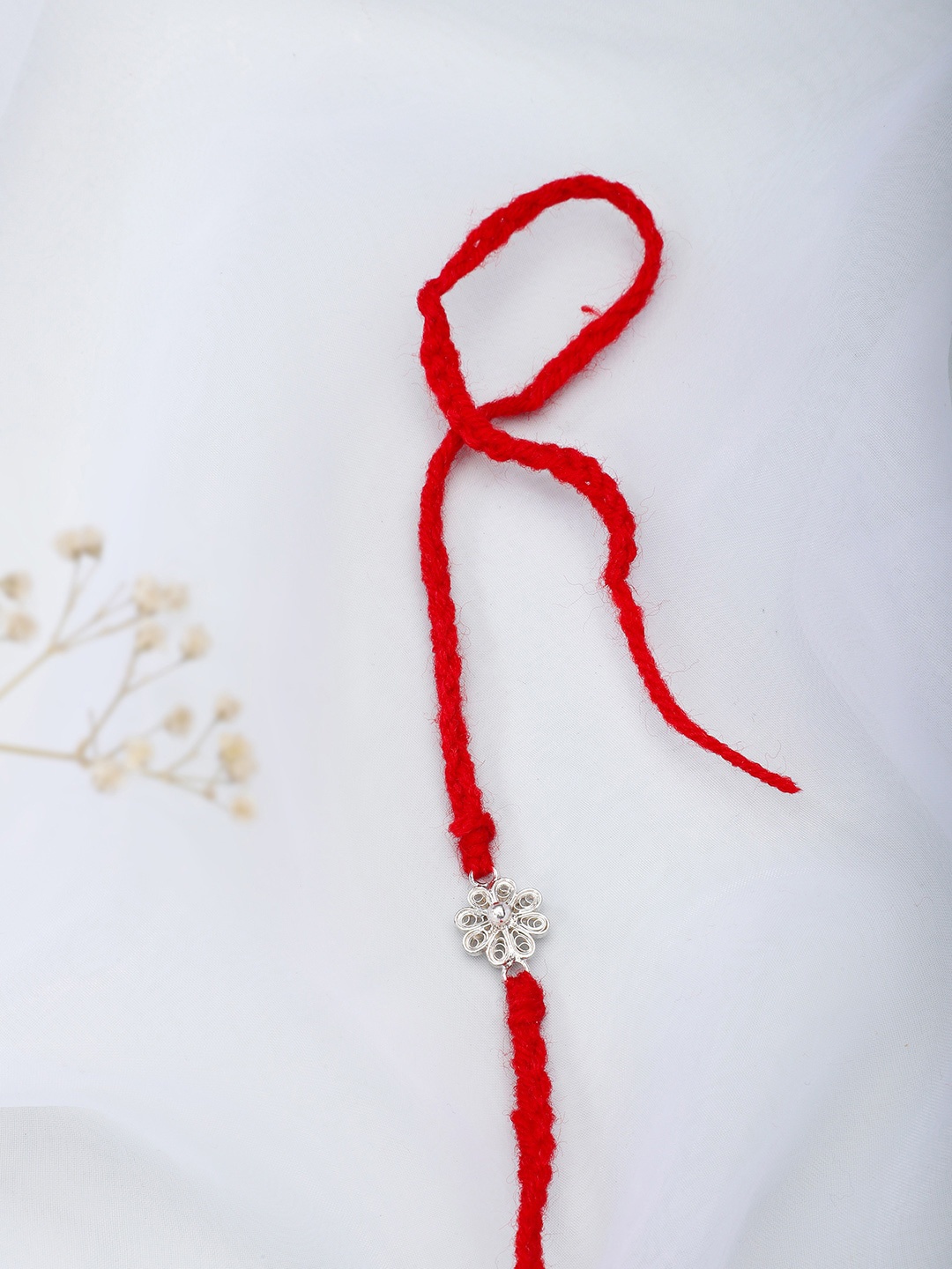 

Fabindia Red & Silver-Toned Thread Rakhi