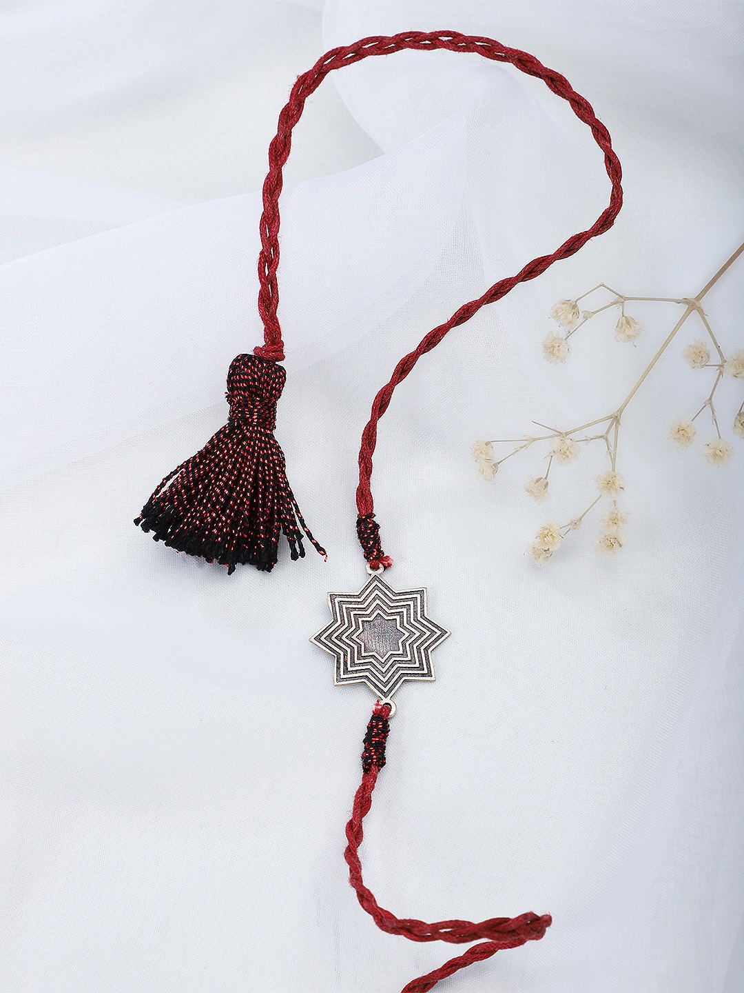 

Fabindia Maroon & Silver-Toned Thread Rakhi