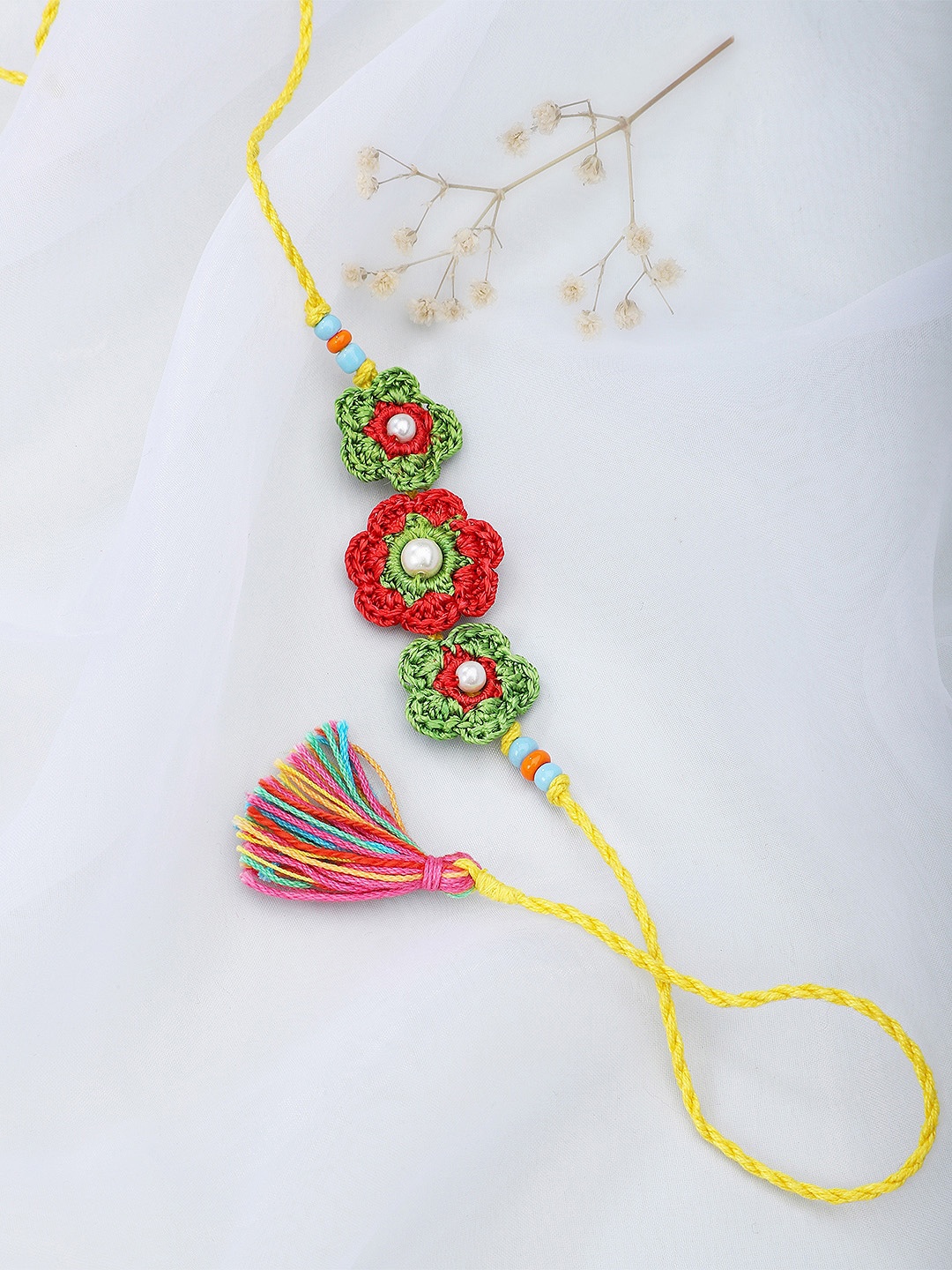 

Fabindia Green & Red Thread Rakhi