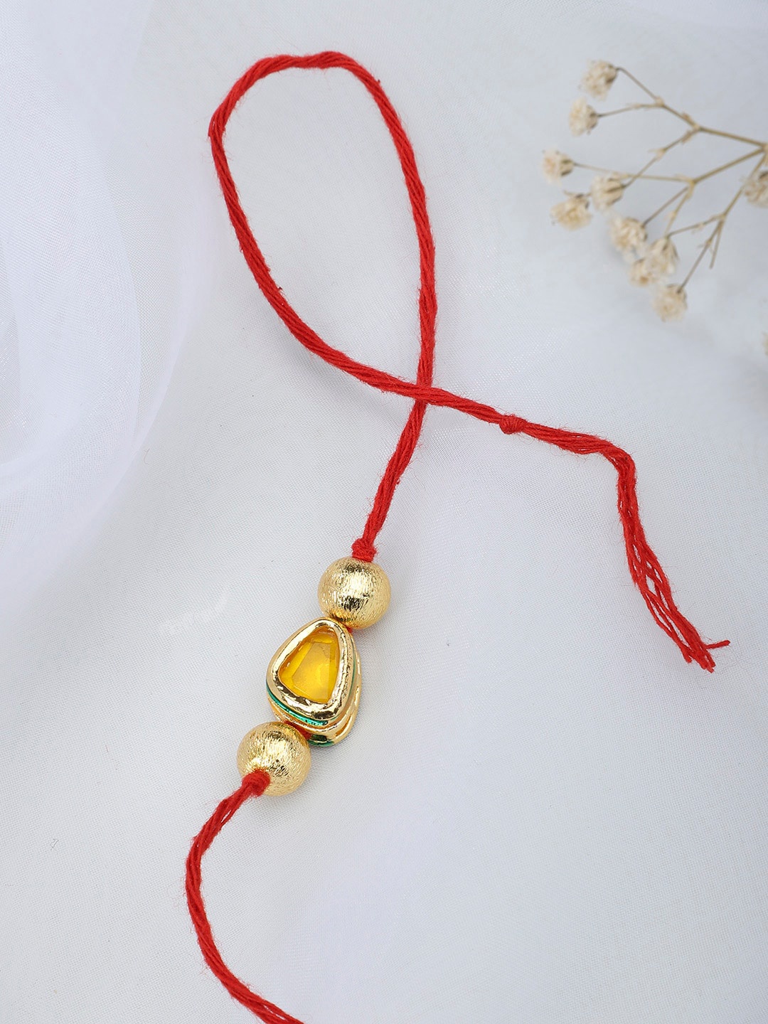 

Fabindia Red & Gold-Toned Thread Rakhi