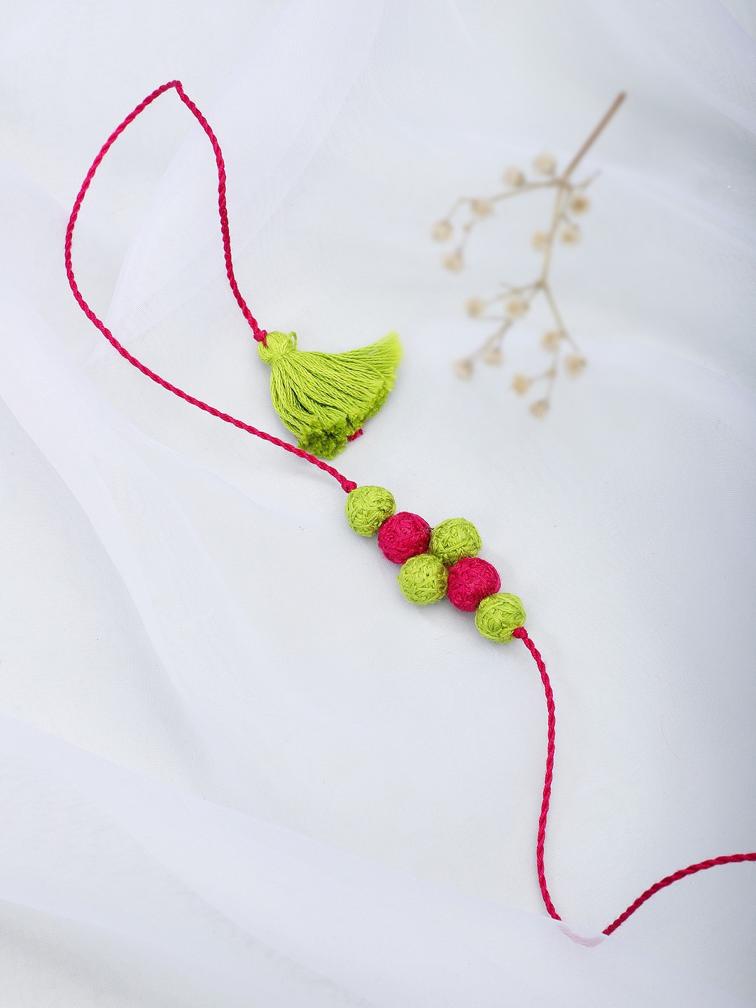 

Fabindia Green & Pink Thread Rakhi
