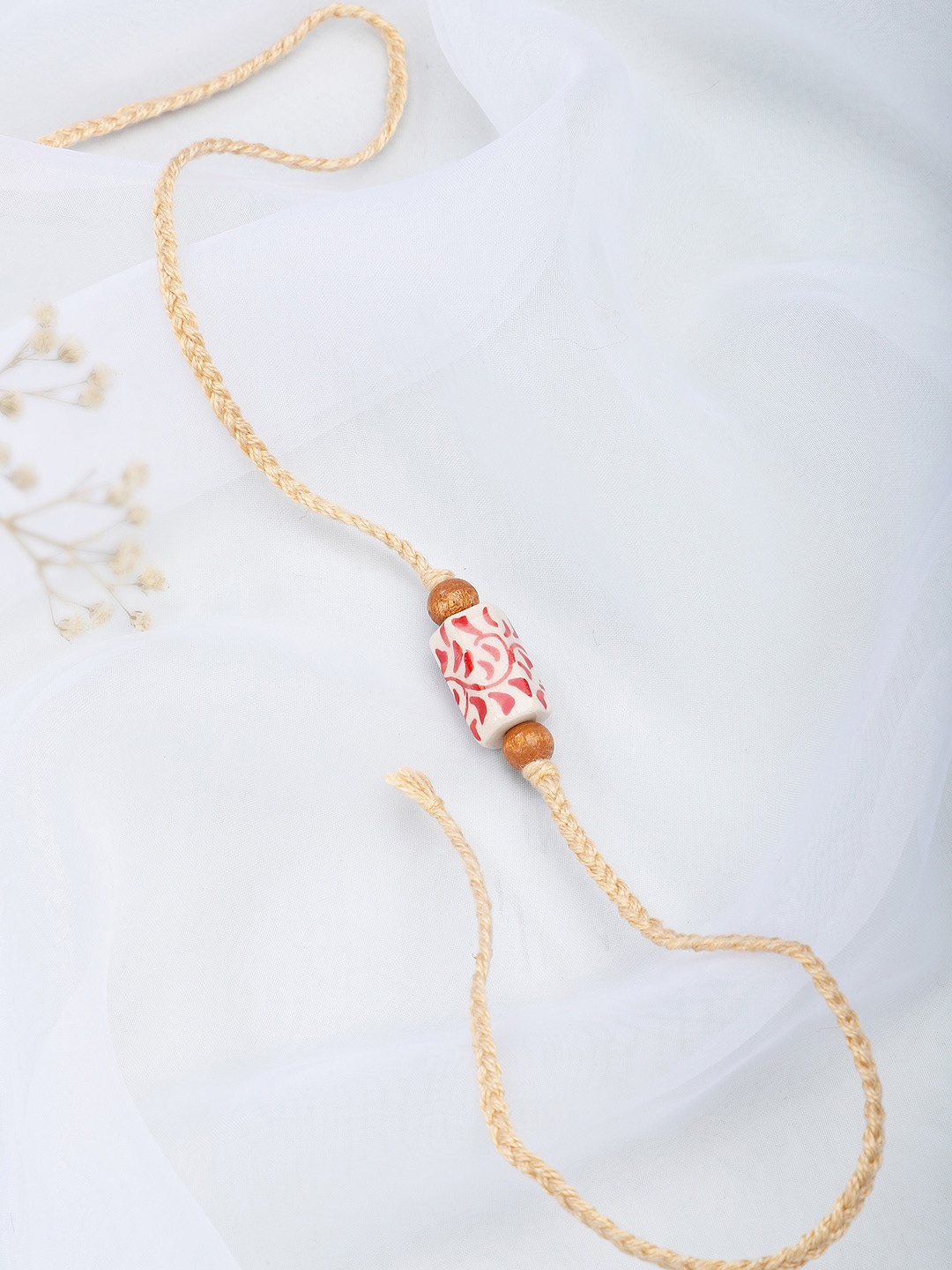

Fabindia Beige Thread Rakhi