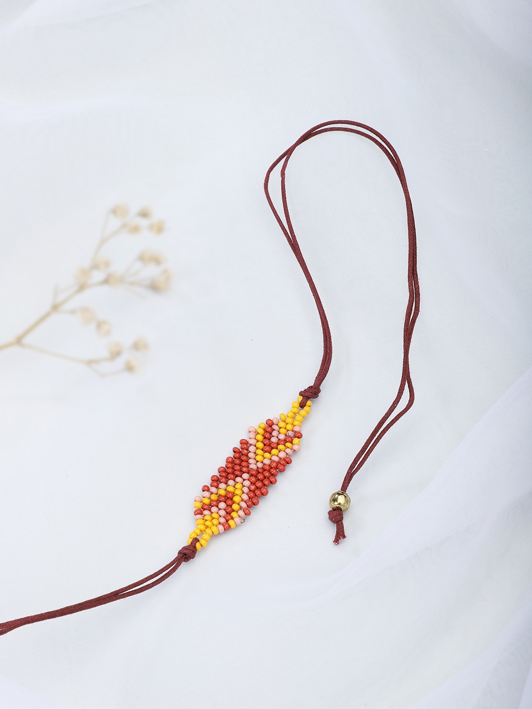 

Fabindia Brown & Yellow Wraparound Rakhi