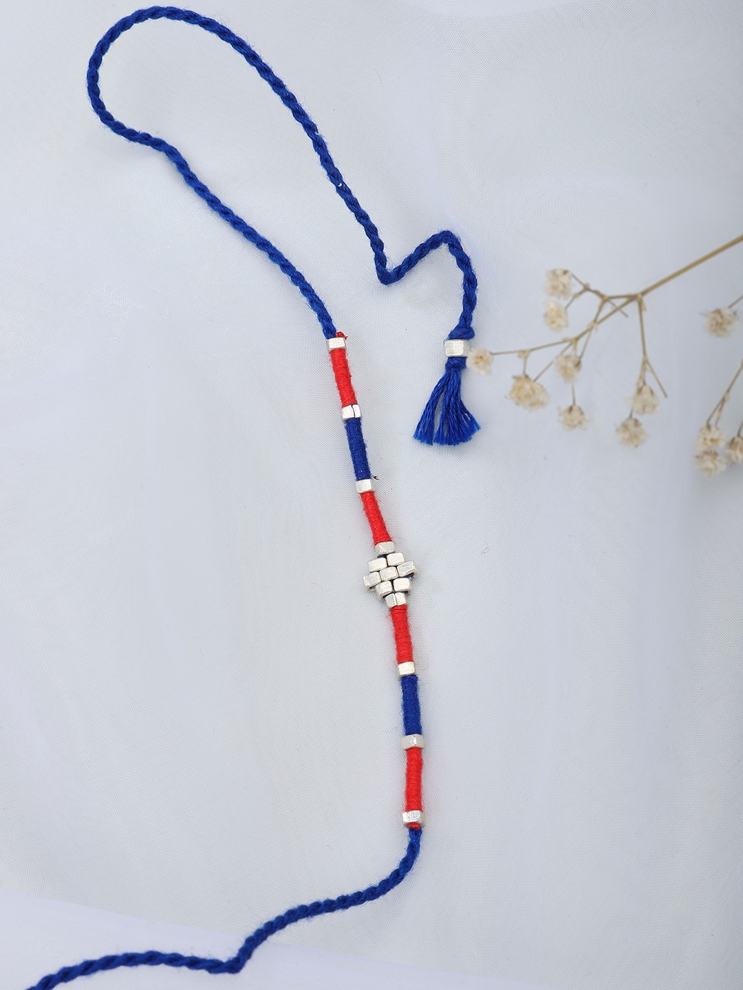 

Fabindia Red & Navy Blue Wraparound Rakhi
