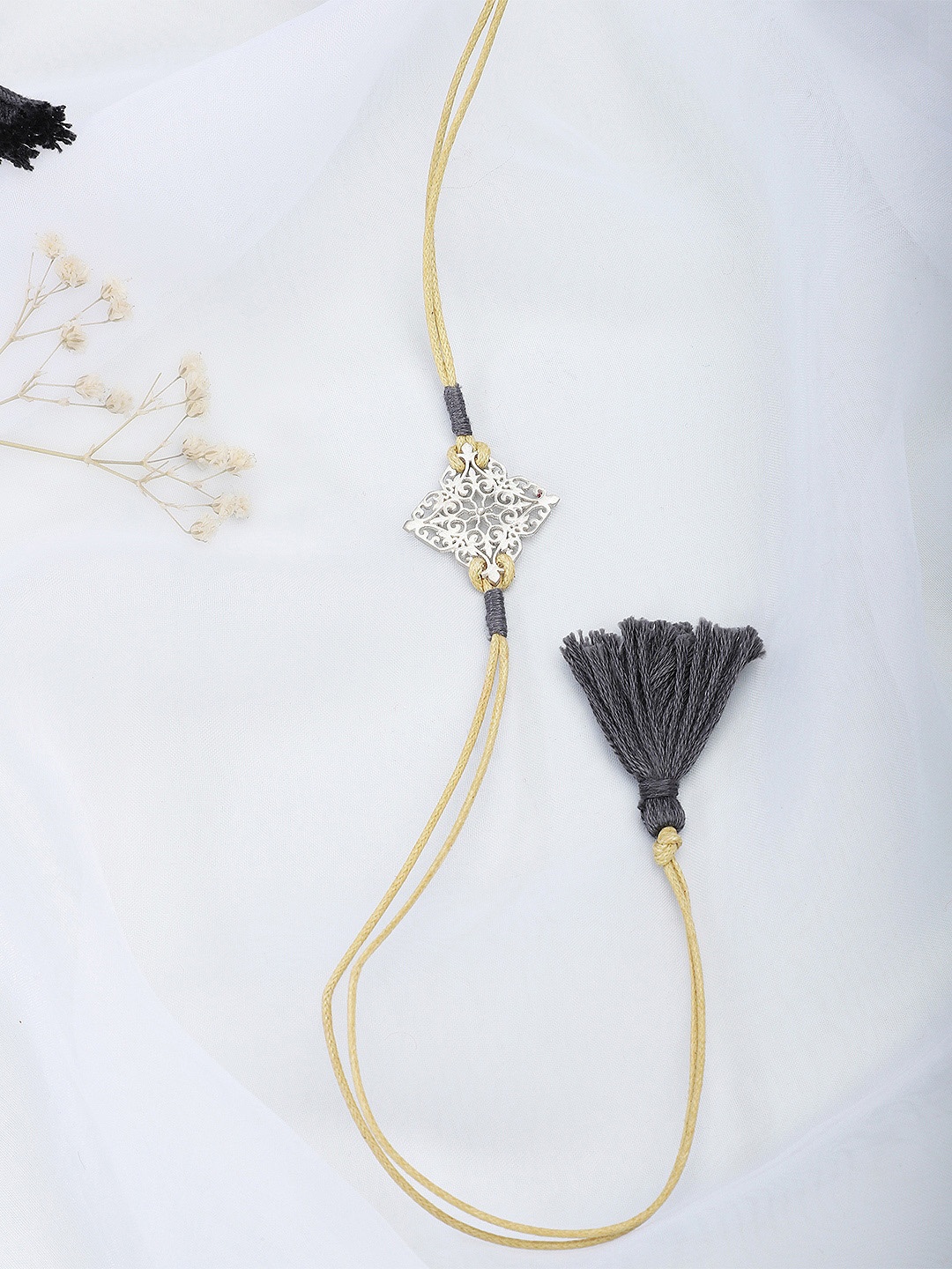 

Fabindia Beige & Silver-Toned Thread Rakhi