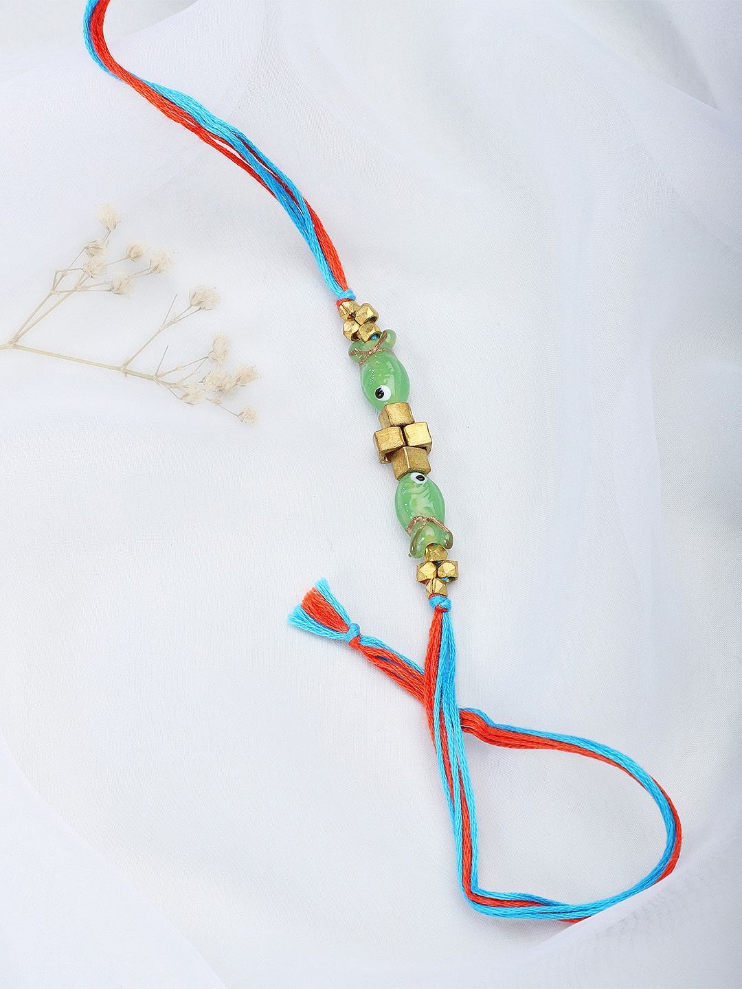 

Fabindia Blue & Gold Beaded Thread Rakhi