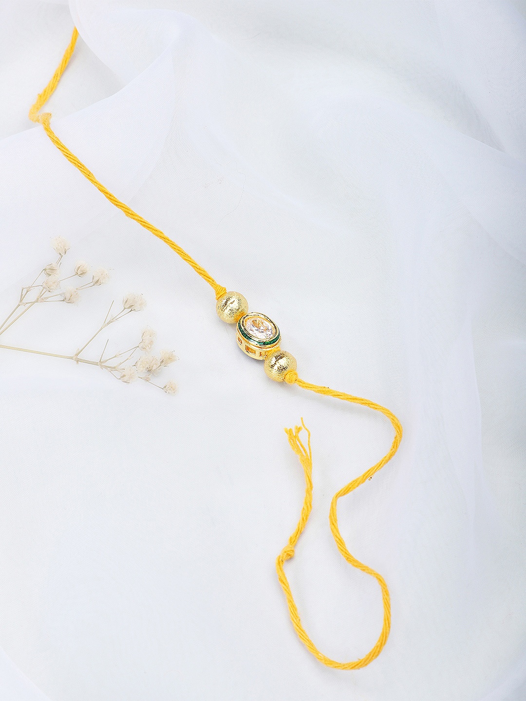 

Fabindia Yellow & Gold-Toned Thread & Metal Rakhi
