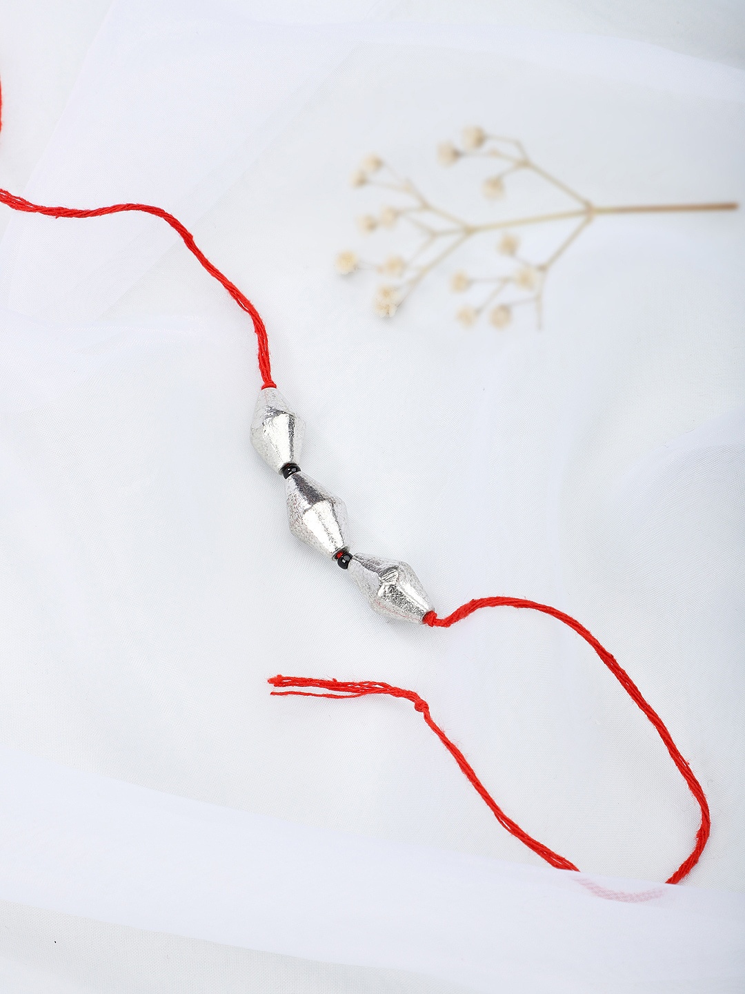 

Fabindia Red & Silver-Toned Thread Rakhi