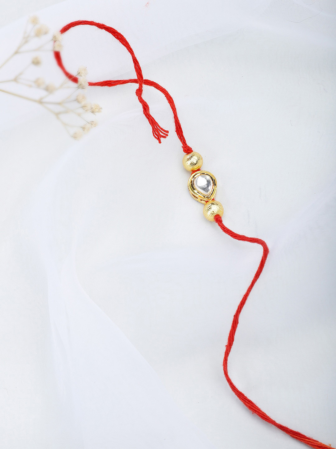 

Fabindia Women Red & Gold Rakhi