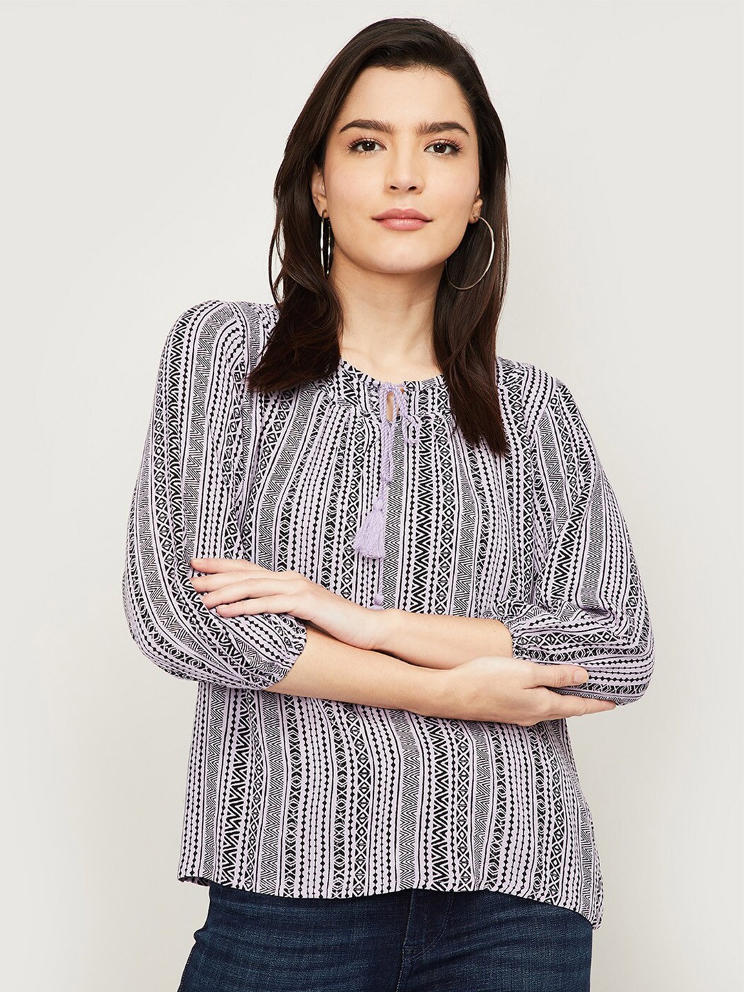 

Fame Forever by Lifestyle Lavender & Black Printed Tie-Up Neck Regular Top