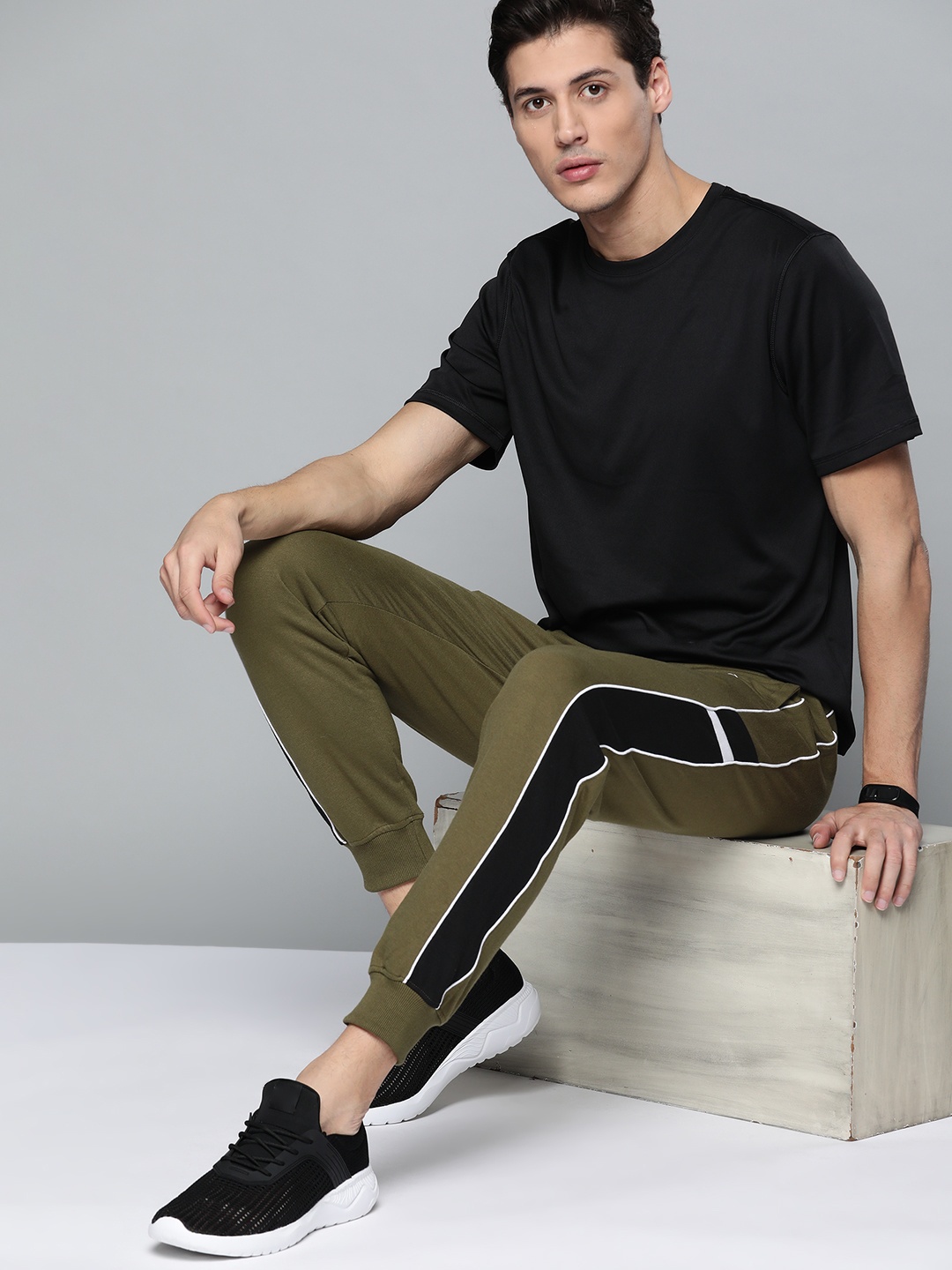 

Slazenger Men Olive Green Solid Joggers With Side Stripe Detail