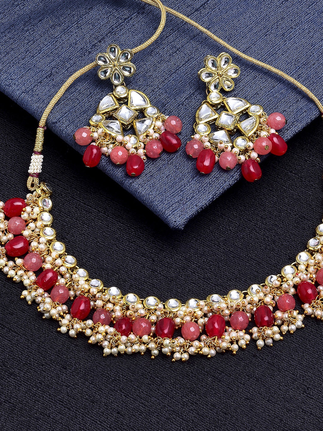 

KARATCART Gold-Plated White & Red Kundan-Studded & Pearl Beaded Handcrafted Jewellery Set