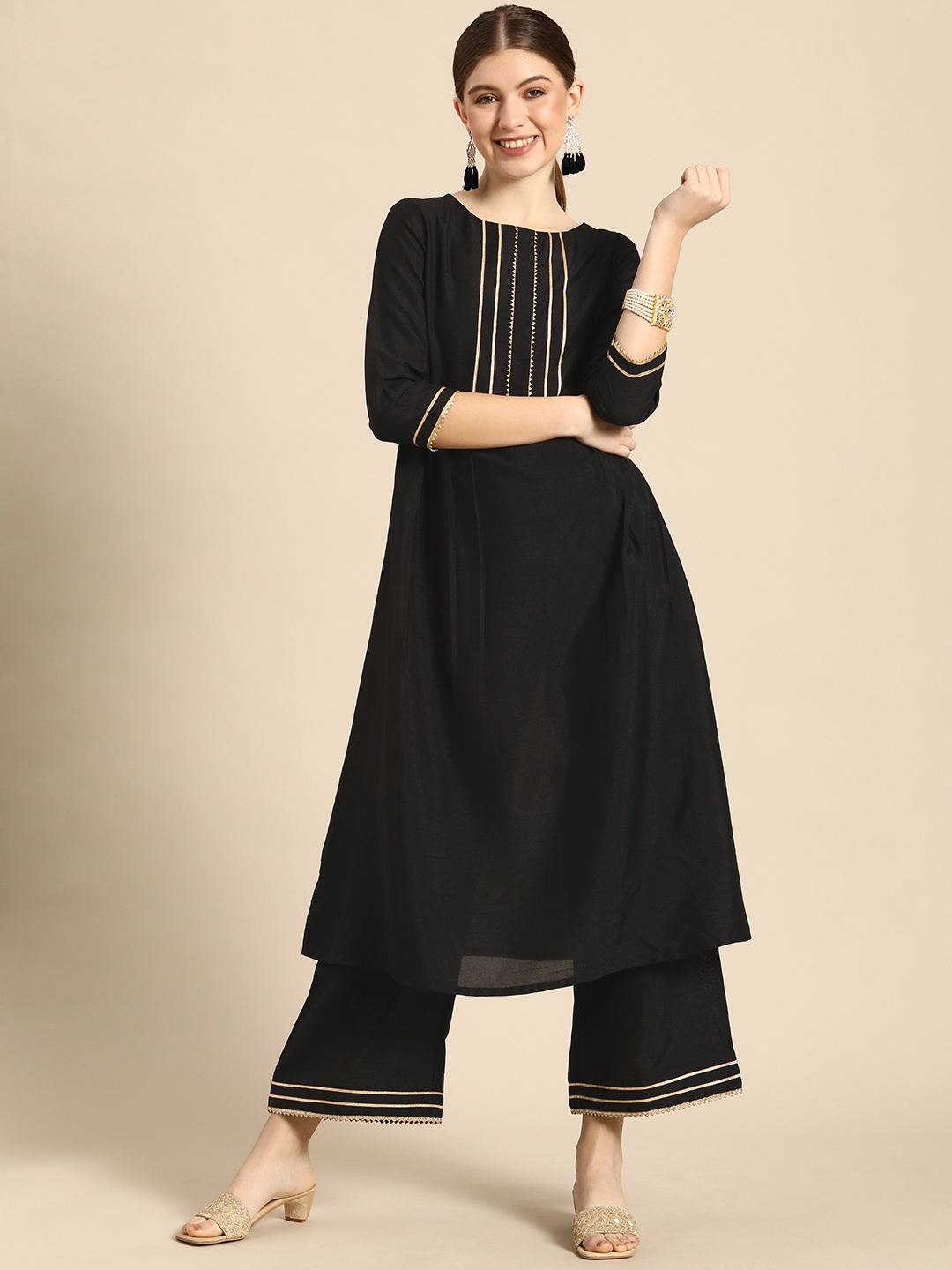 

Janasya Women Black Regular Kurta with Palazzos