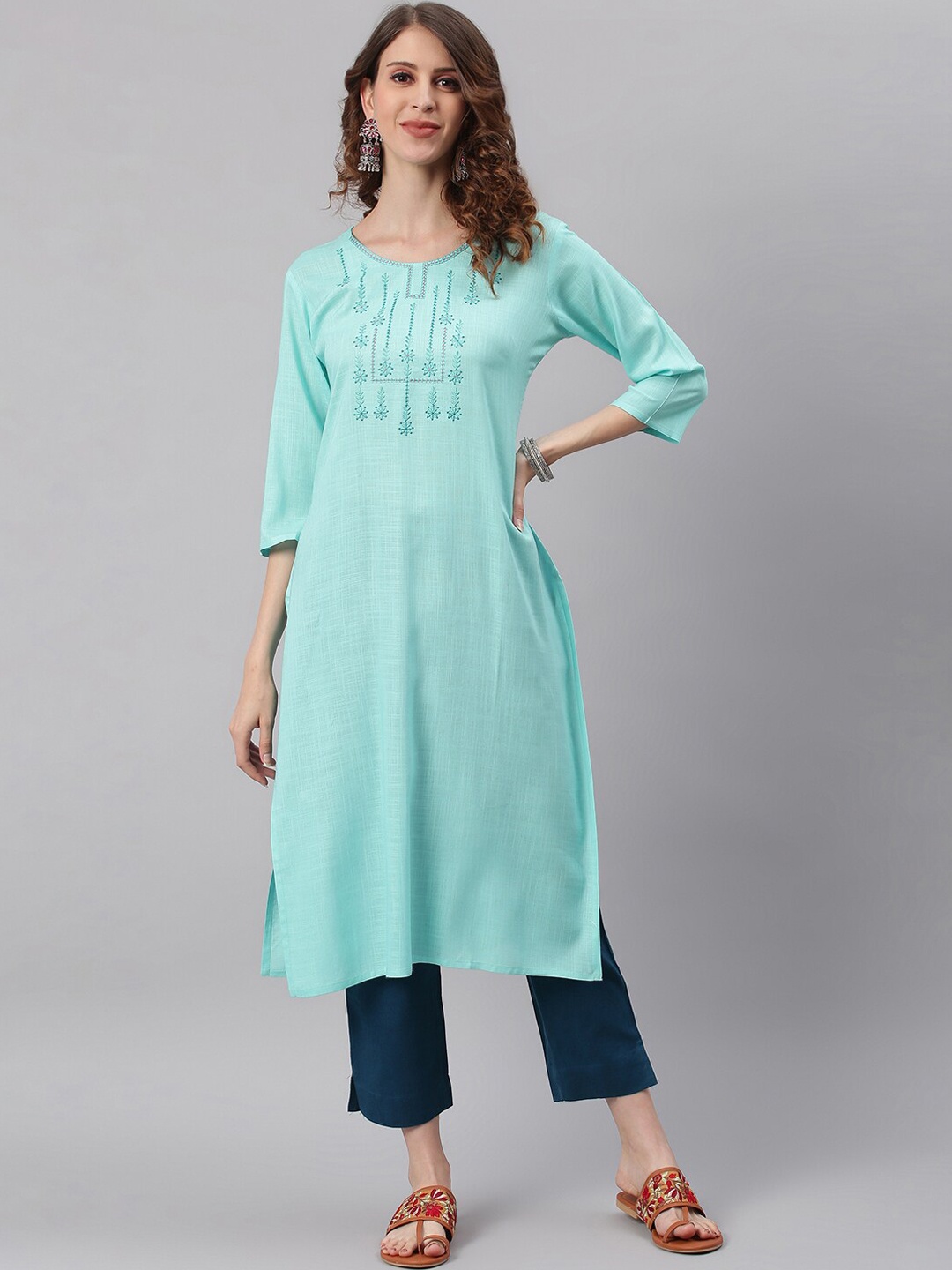 

Janasya Women Turquoise Blue Quirky Yoke Design Flared Sleeves Thread Work Kurta